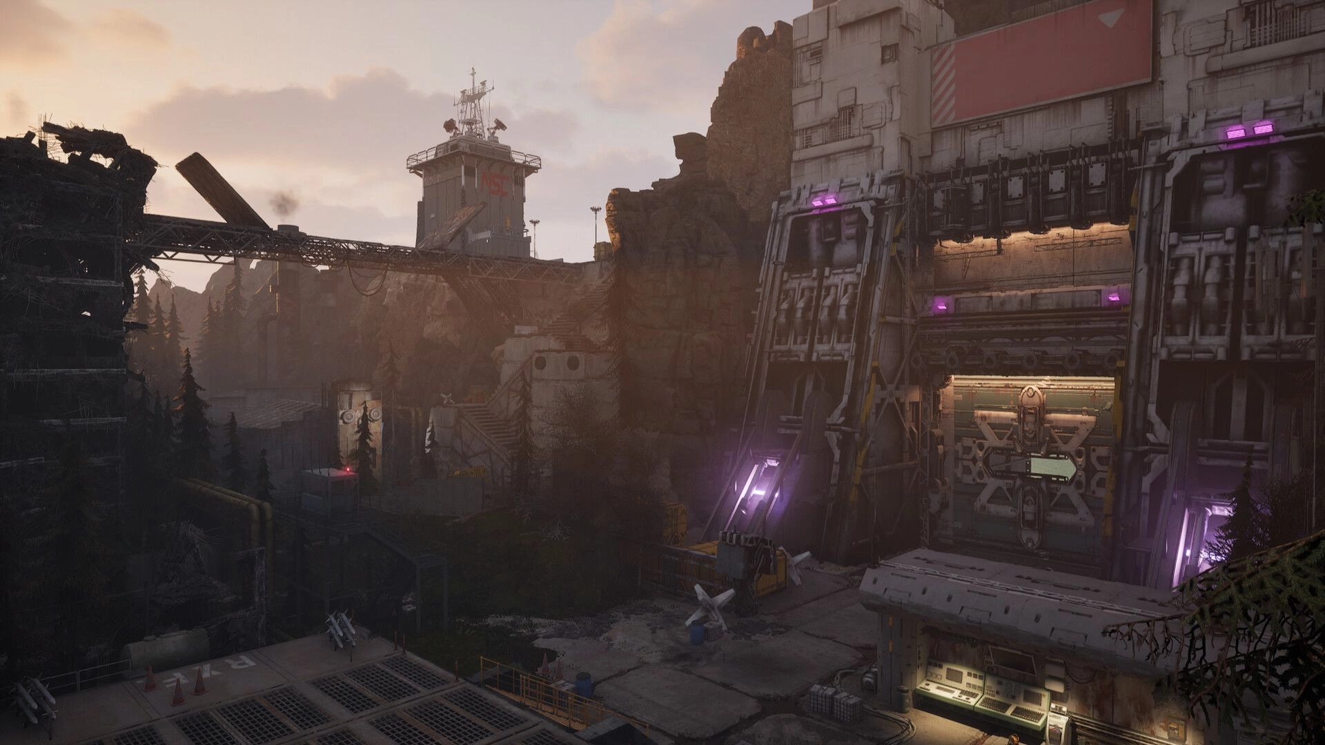 Desserted: Abandoned industrial facility amidst rocky terrain and pine trees at dusk