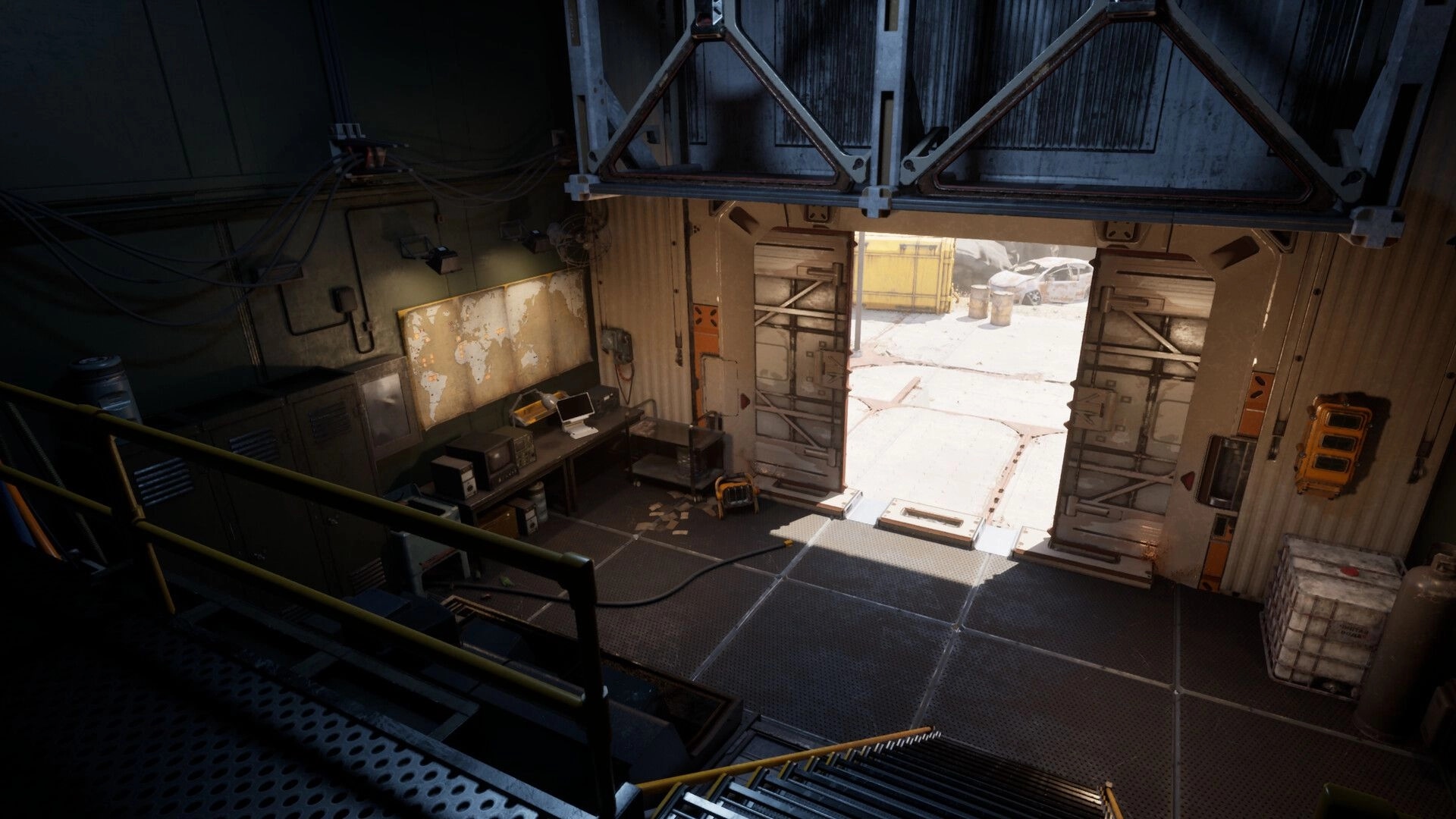 Desserted: Industrial control room with computer equipment and map, opening to a sunlit outdoor area.