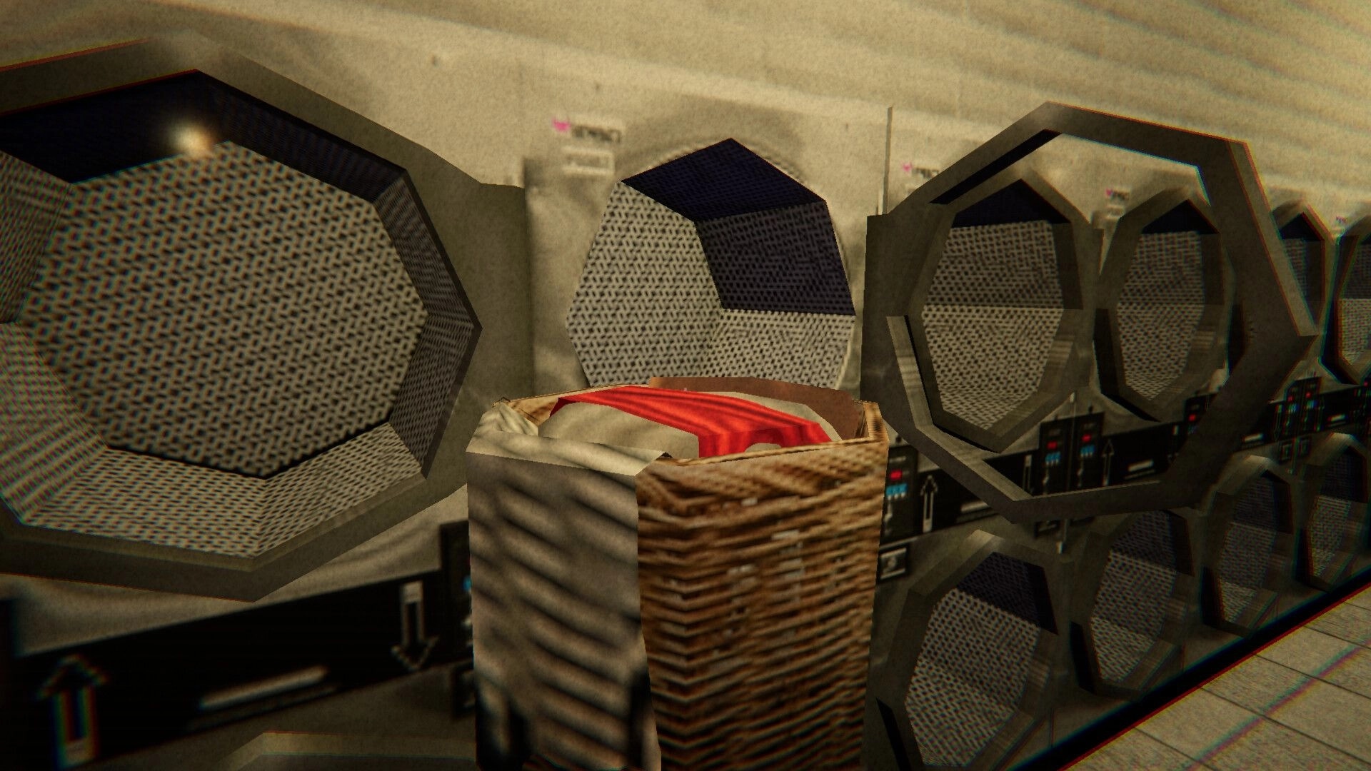 Dirty Laundry: Laundry basket piled with clothes beside open dryers in a dim laundromat back room.