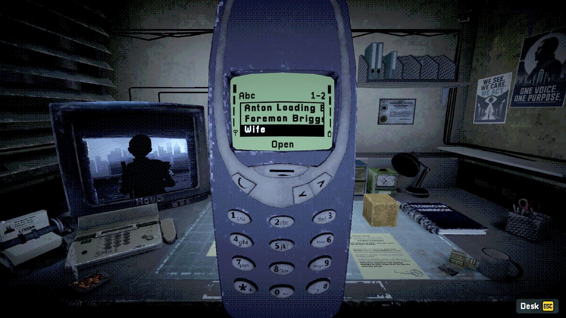 Don’t Pick Up: Phone contact list open on keypad screen at a cluttered office desk with CRT monitor.