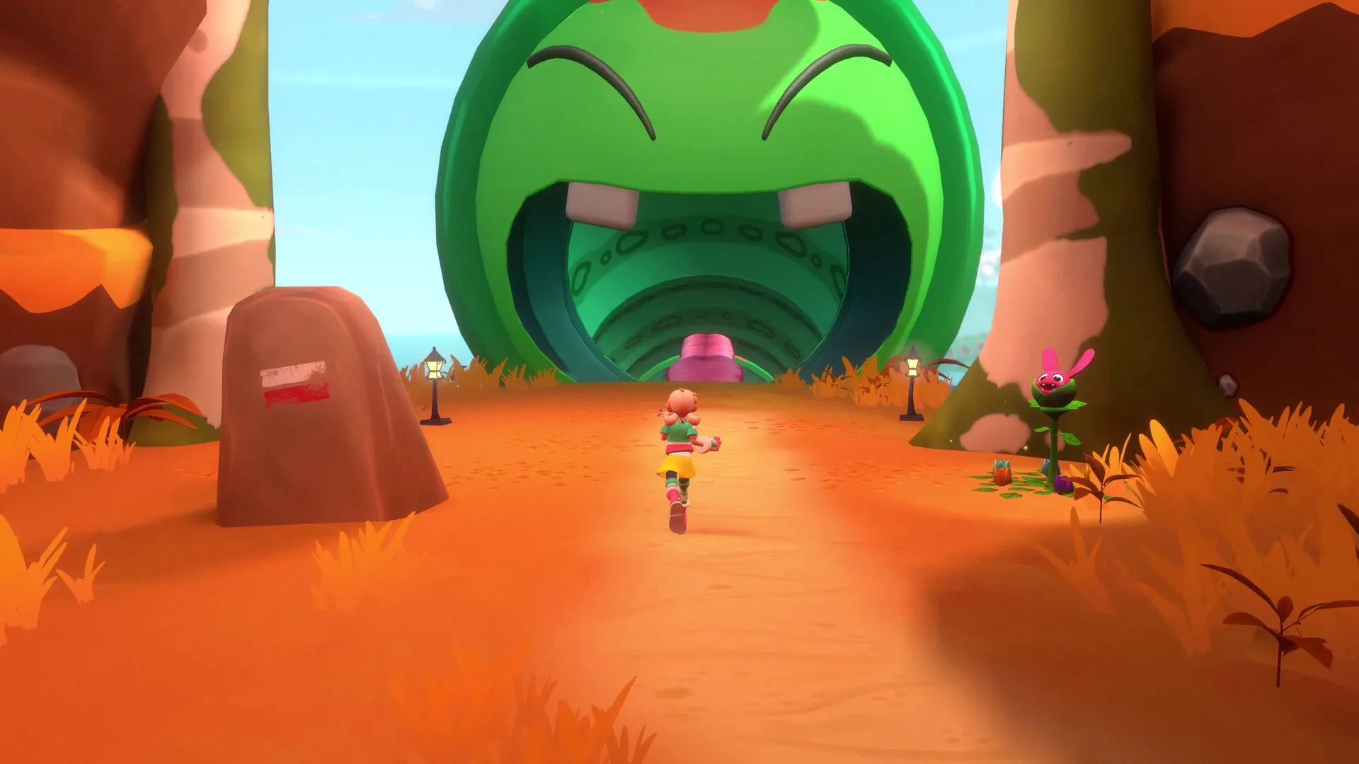 Dracamar: Caliu runs towards a giant green creature tunnel entrance in a vibrant, colorful landscape.