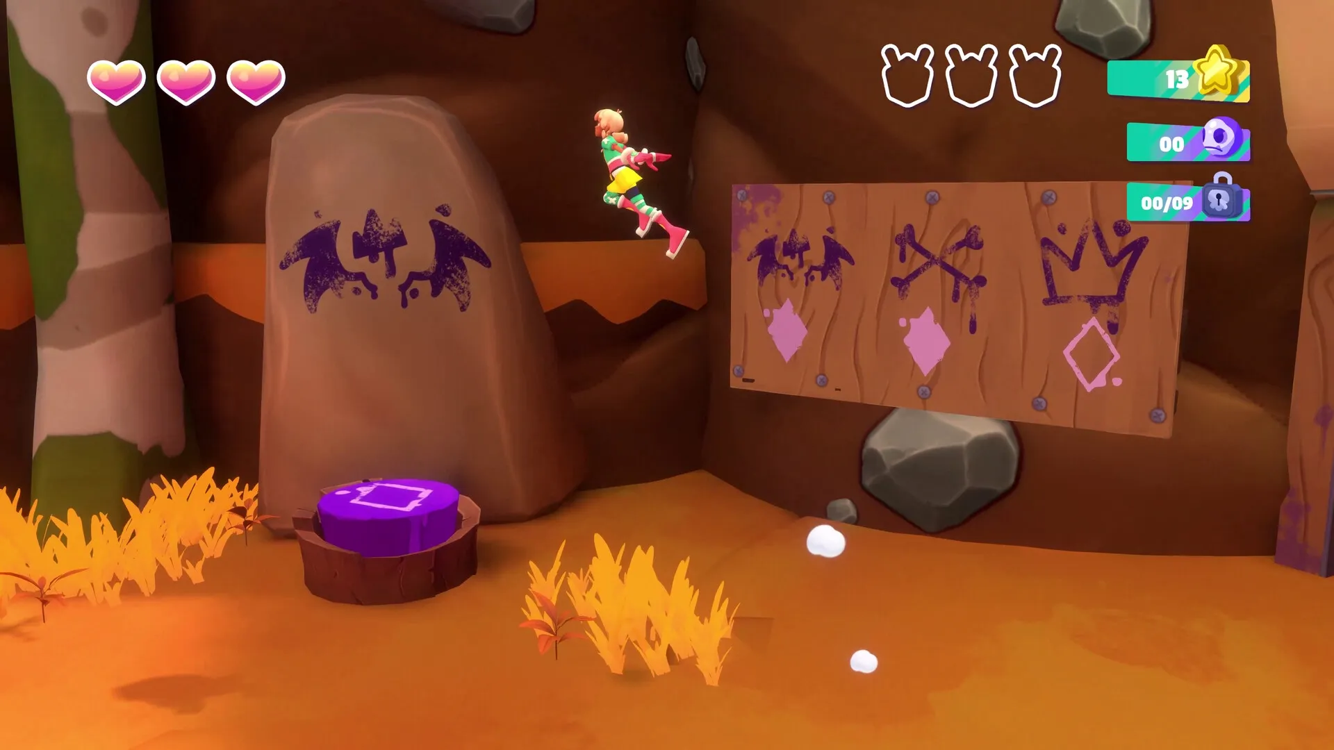 Dracamar: Caliu jumping near symbols on a cave wall in a vibrant rocky environment with UI elements visible