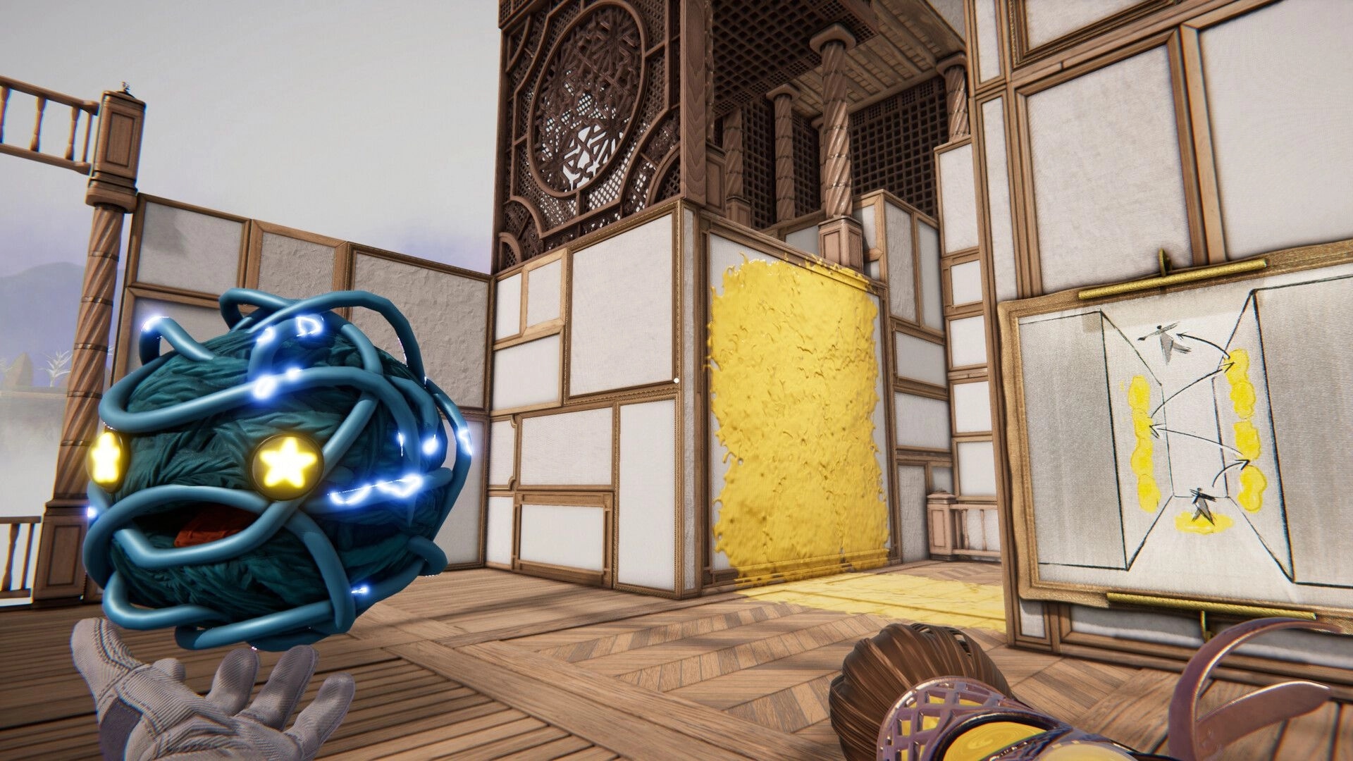Dreampainters: Holding a glowing orb near a yellow paint wall puzzle in a wooden art studio room.