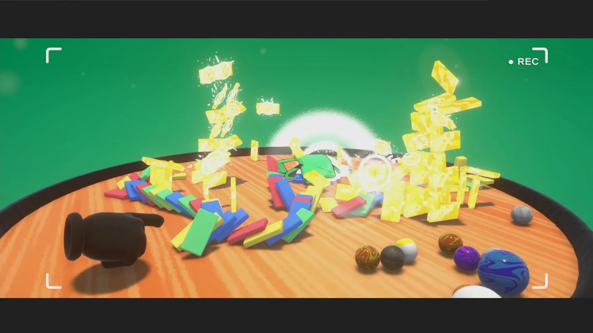 Dumbino: Colorful dominoes topple with explosions on a wooden table, surrounded by scattered balls.