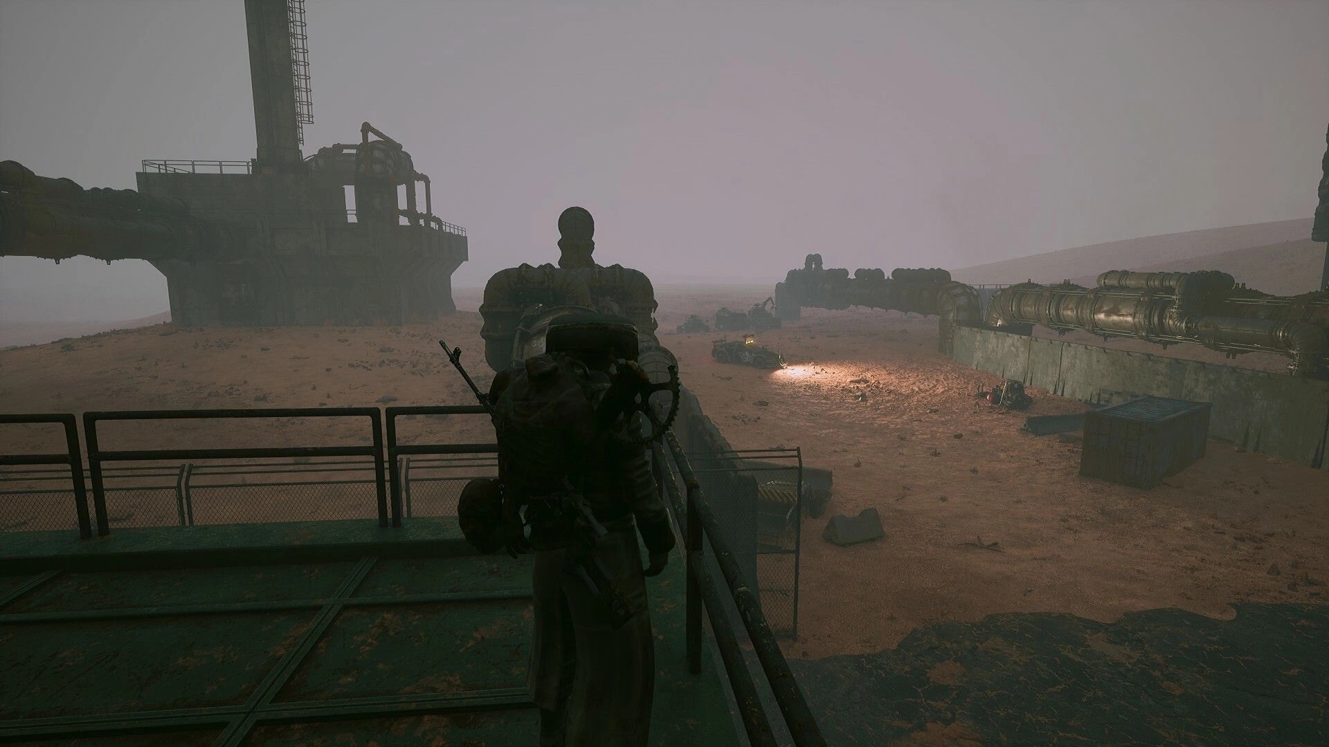 Duneborn: Character overlooks desert landscape with industrial structures and distant vehicle lights
