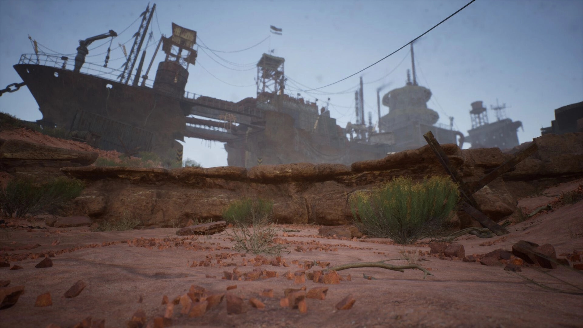 Duneborn: Abandoned desert shipyard with rusted structures and sparse vegetation in arid landscape