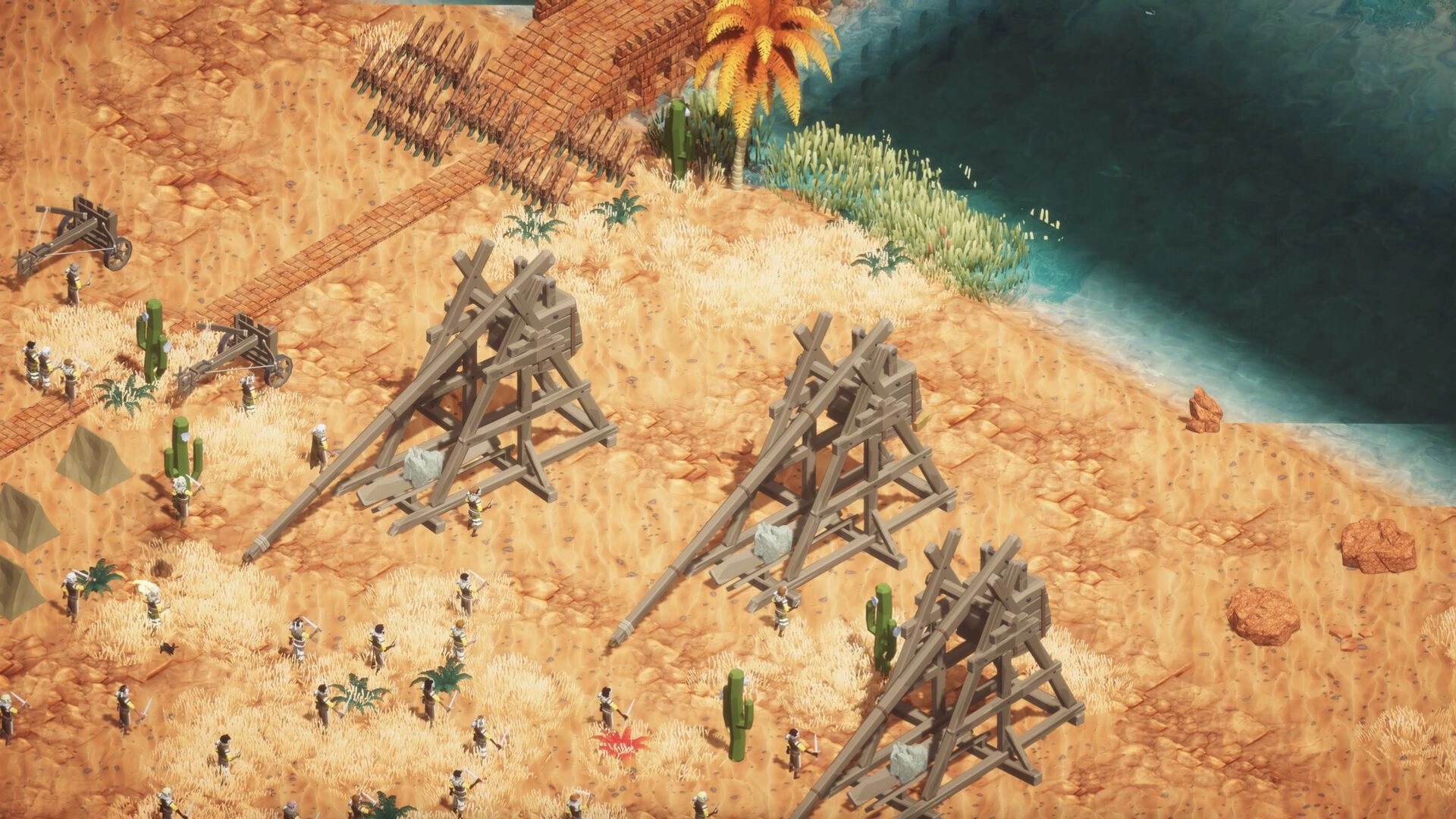 Earth of Oryn: Trebuchets and soldiers on a desert beach near water and a wooden bridge crossing sand