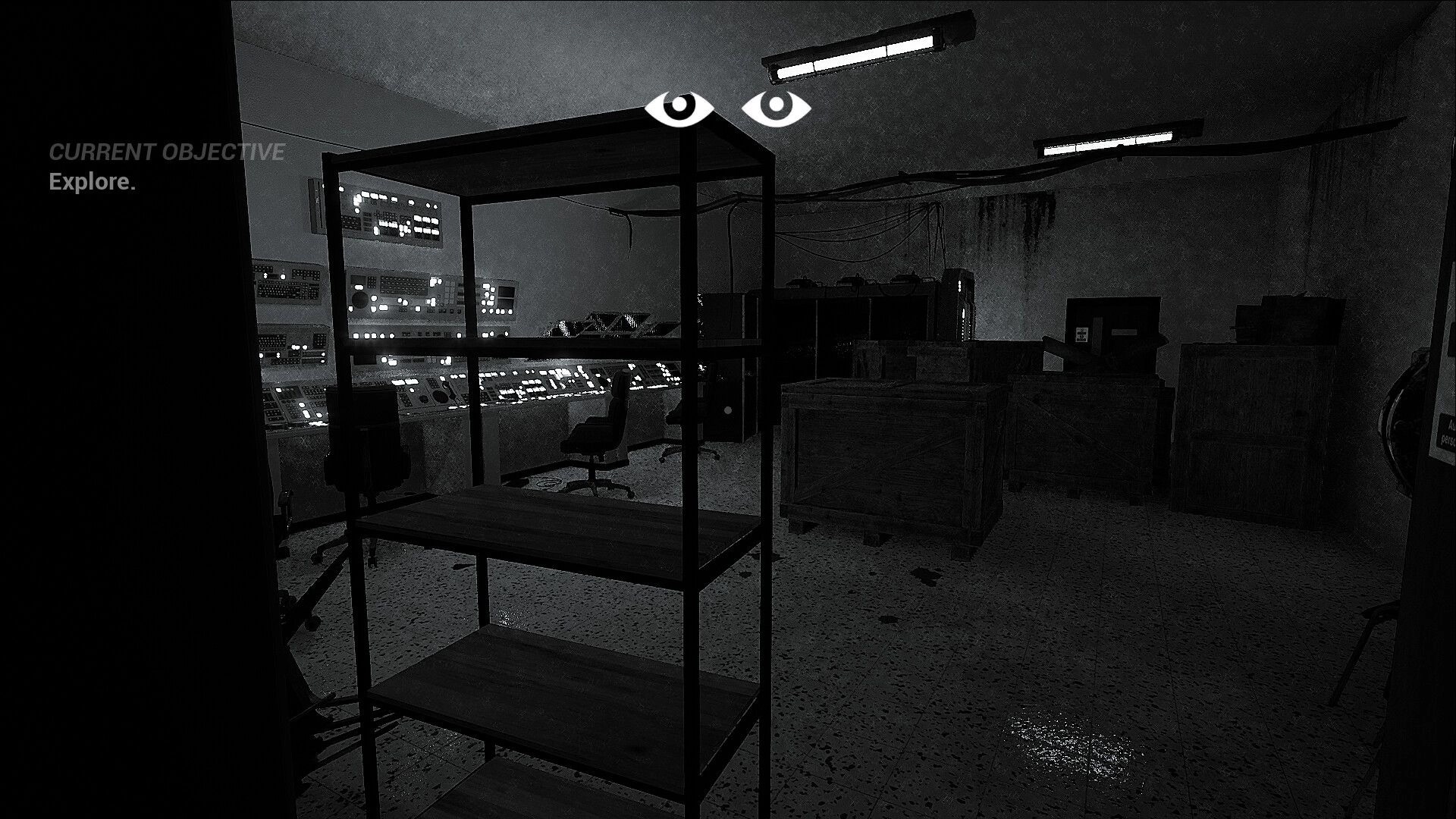 Either Eye: Dark control room with glowing monitors and objective to explore, shelves and crates visible.