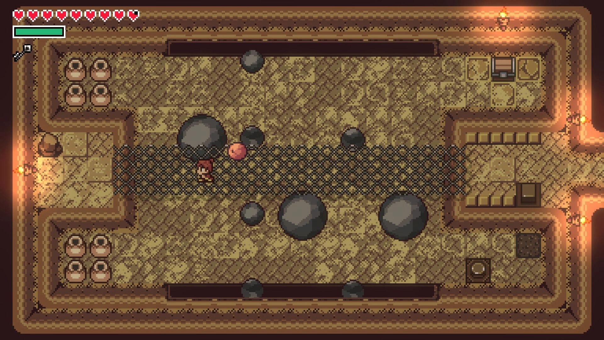 Elementallis: Character navigates dungeon corridor with boulders and pots, health and mana displayed