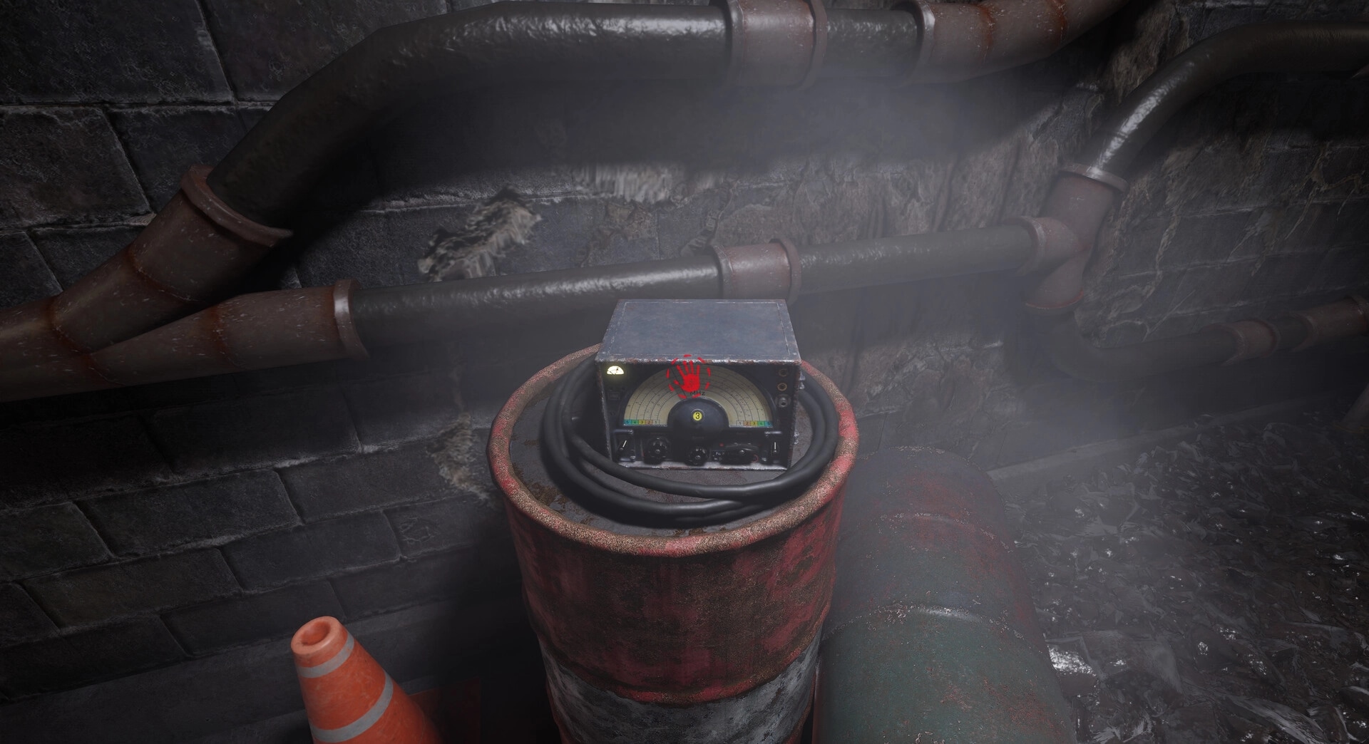 EMOTIONLESS: Old radio on rusty barrel with red handprint in dimly lit tunnel with pipes and debris
