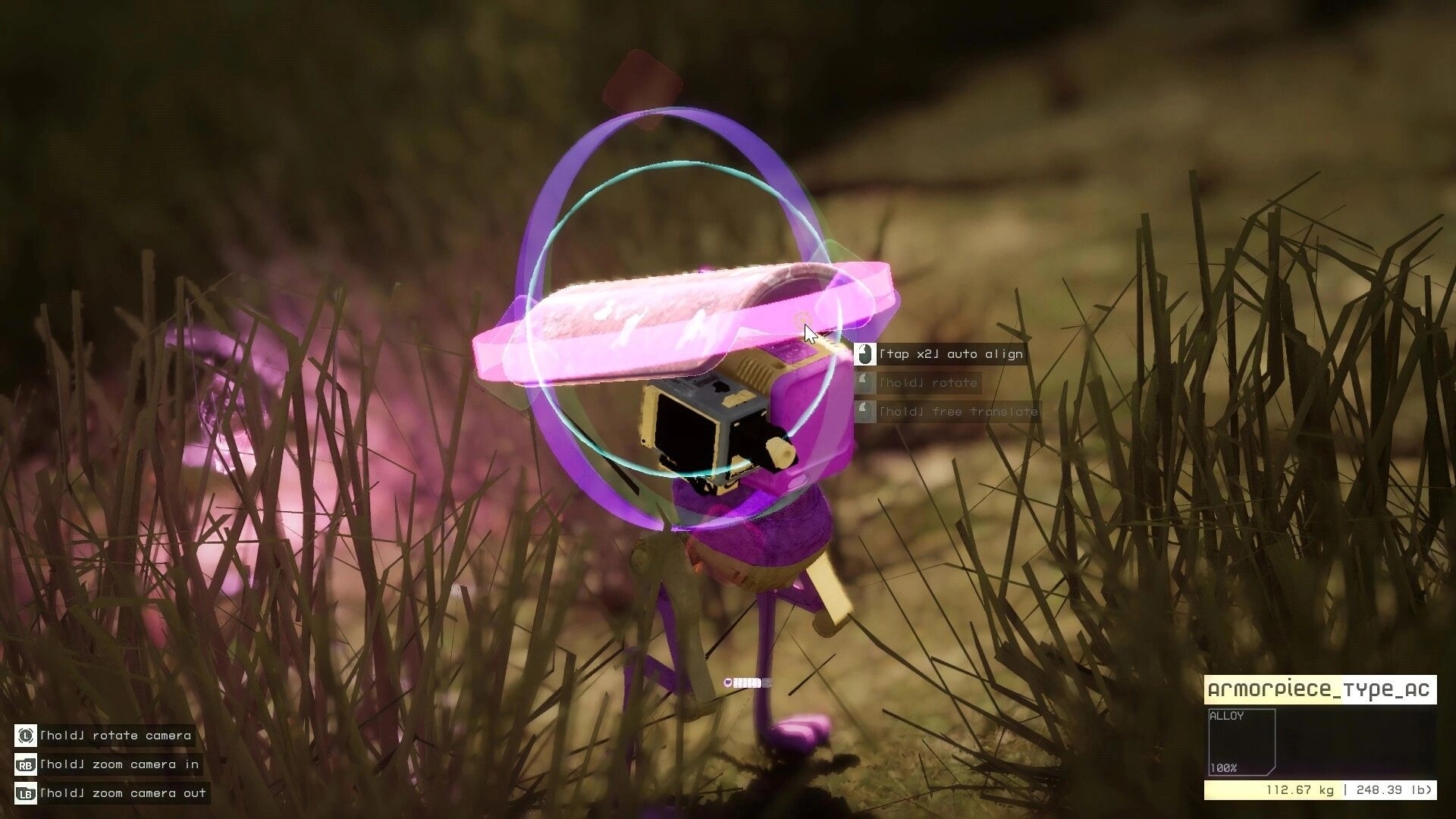 Endless Machines: Loot pickup UI highlighting armor piece in tall grass with rotate and zoom prompts.