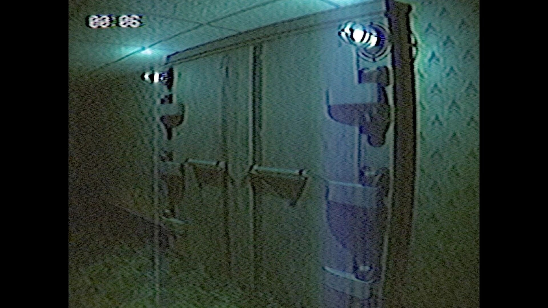 ENTRY_13: VHS-style view of a dingy hallway with wall lamps and a door, timer UI in corner.