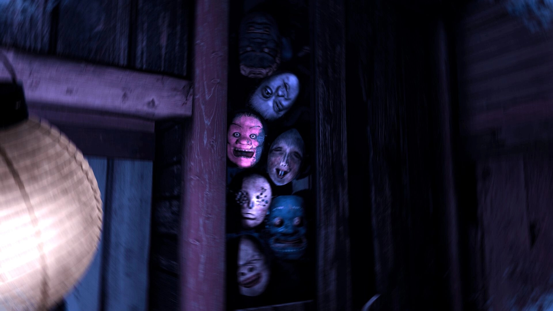 Eternal Haunt: Creepy masks and doll faces crammed in a narrow wooden closet beside a futon bed.