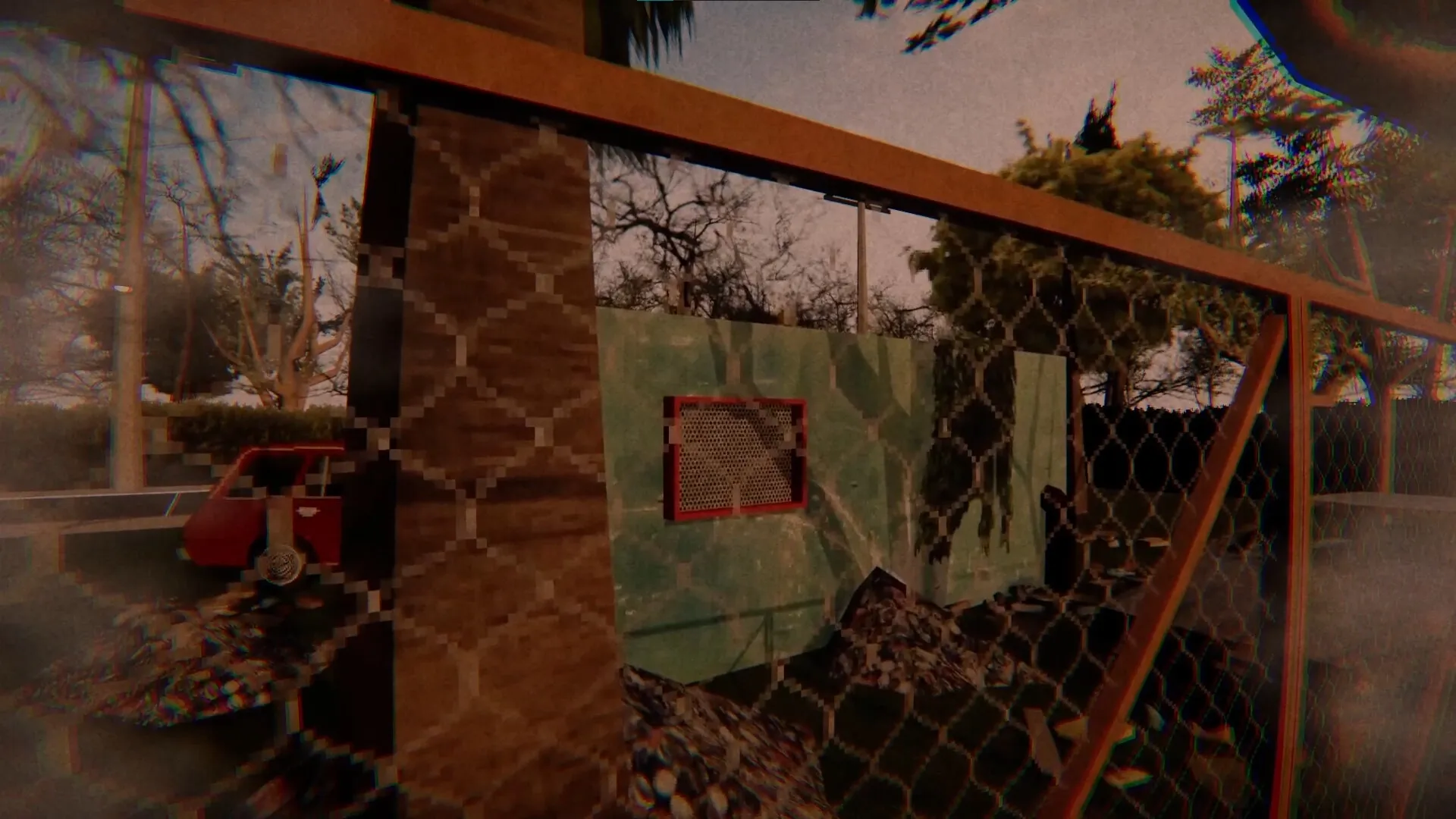 Evil Lurks Below: Harry Walters peers through a chain-link fence at a mysterious, overgrown backyard.