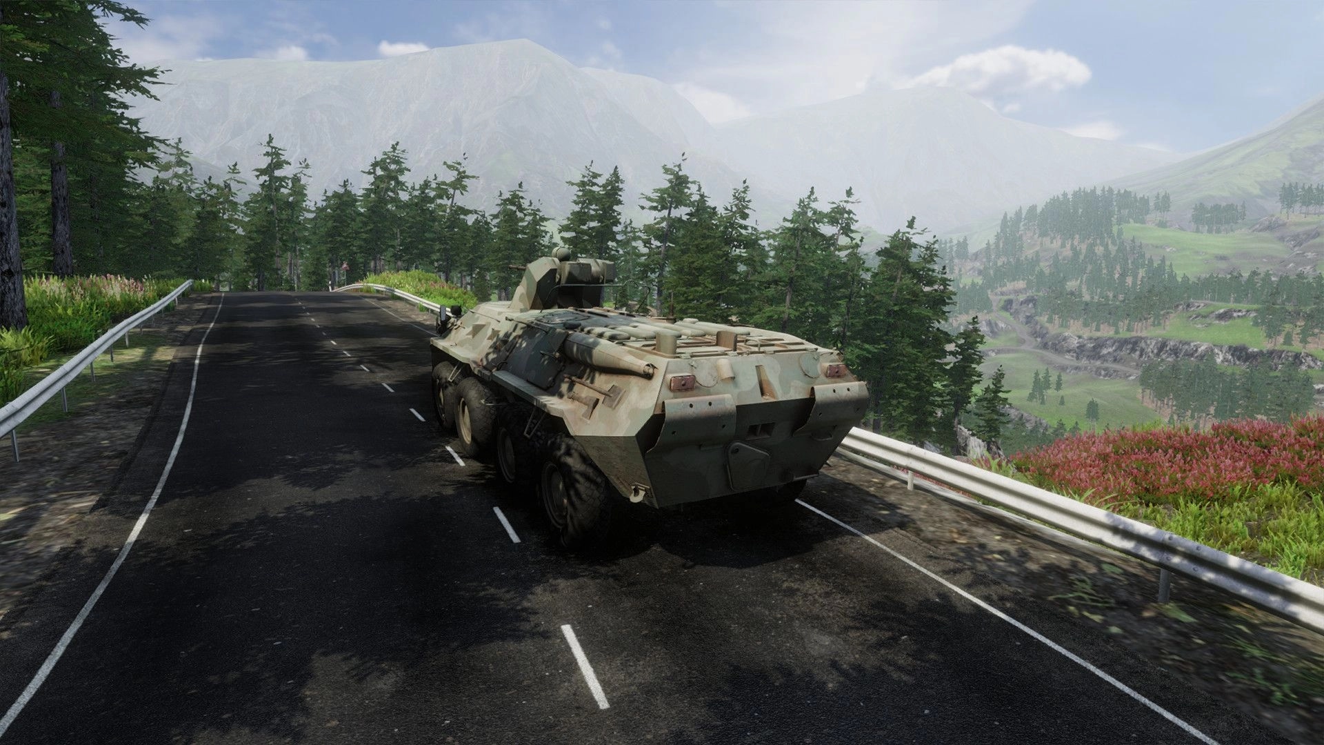 eXpanSIM: Military vehicle driving on a mountain road surrounded by forests and distant hills