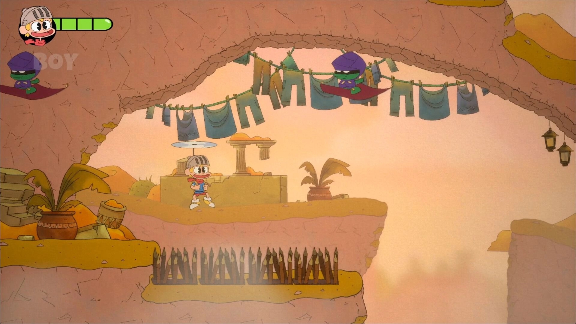 Fantasy Boy: Boy facing enemy in desert cave with spikes below and health bar visible