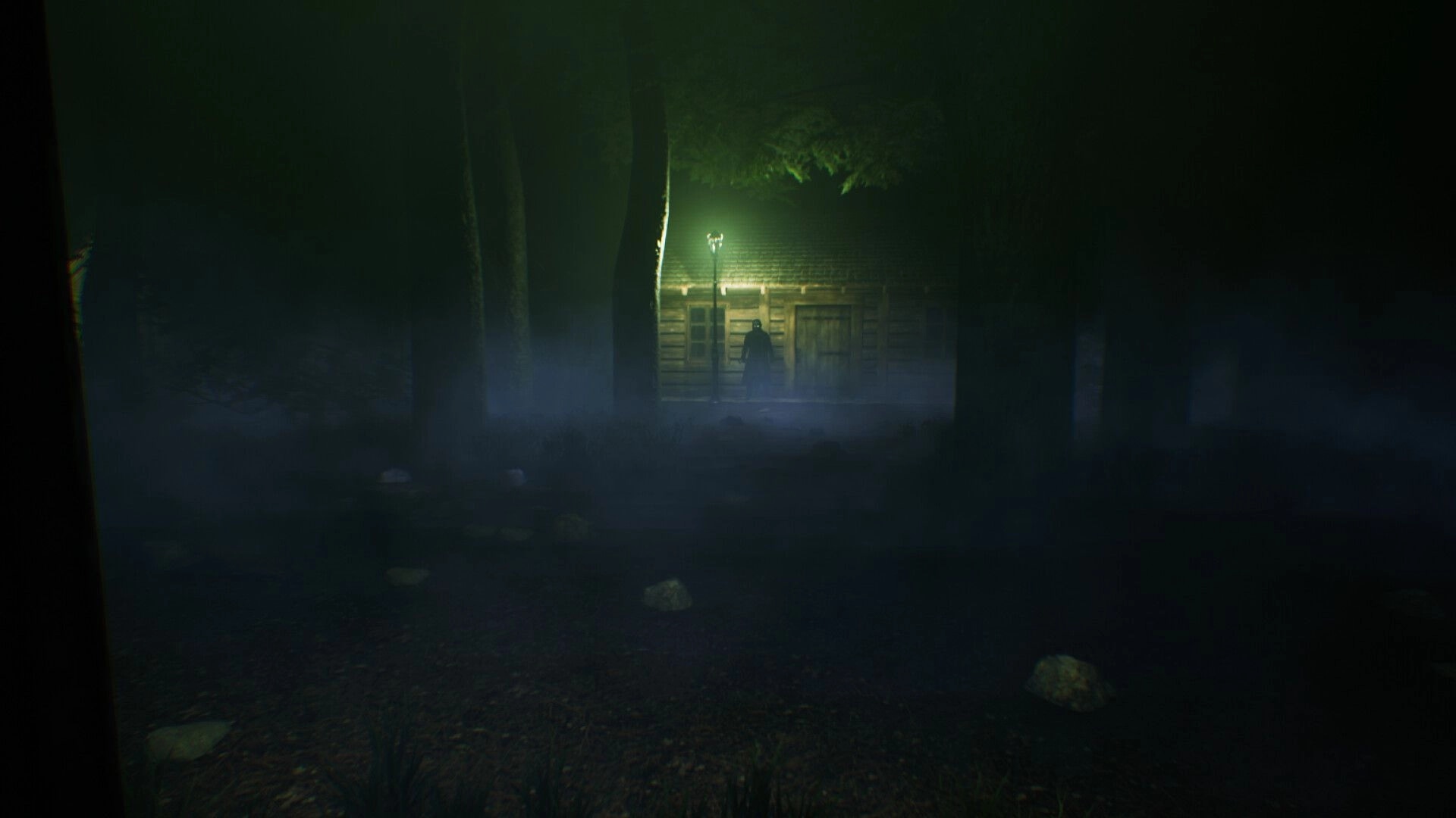 Fear The Reaper: Shadowy figure stands near illuminated cabin in misty forest clearing