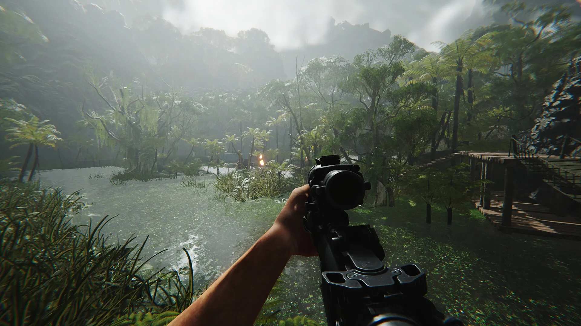 FEROCIOUS: First-person view aiming a rifle in a dense jungle with a distant fire near wooden structures