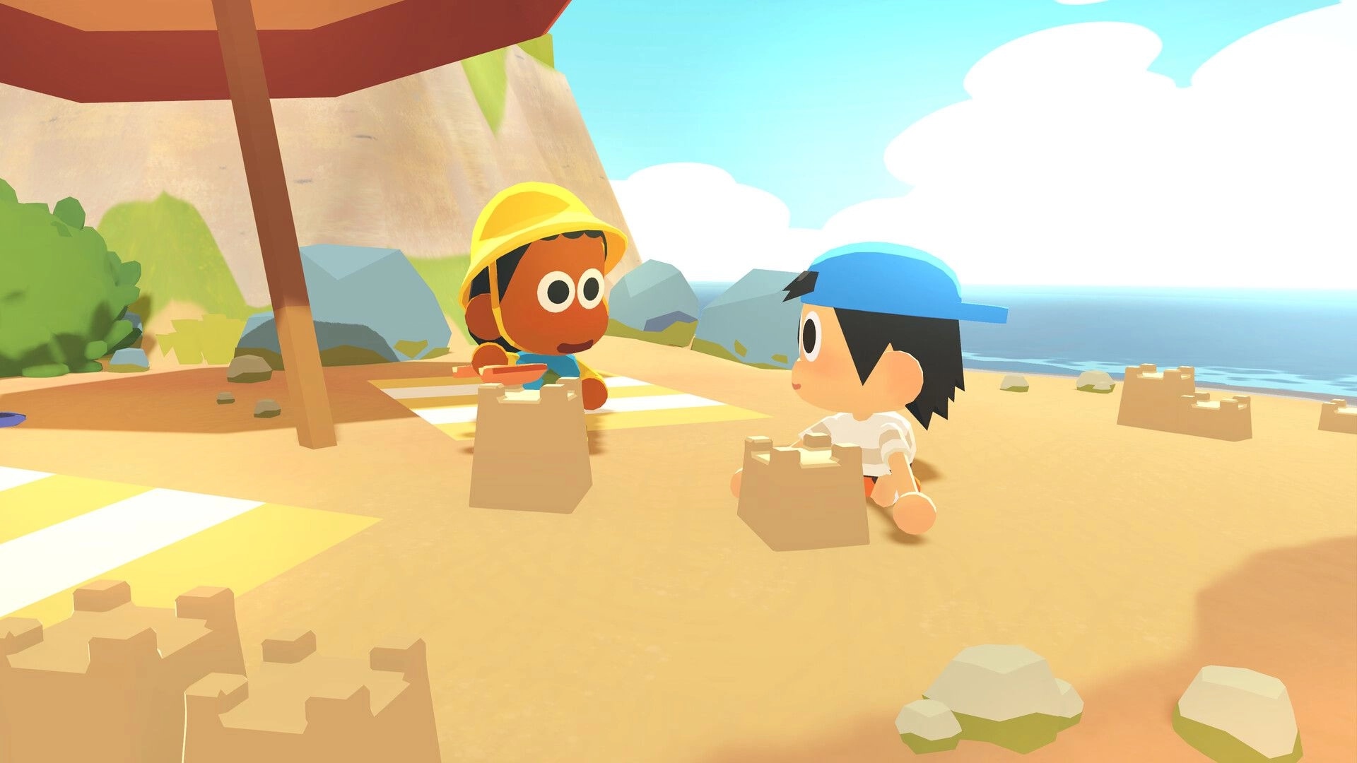 Find Your Words: Two kids sit by sandcastles under a beach umbrella on a sunny shore by cliffs.