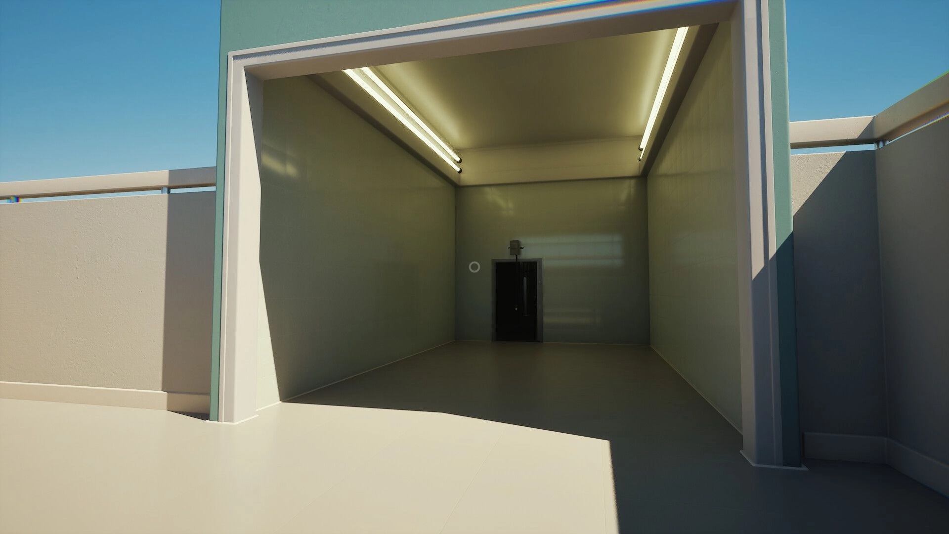 First: Empty garage-like room with open entrance and closed door under bright fluorescent lights
