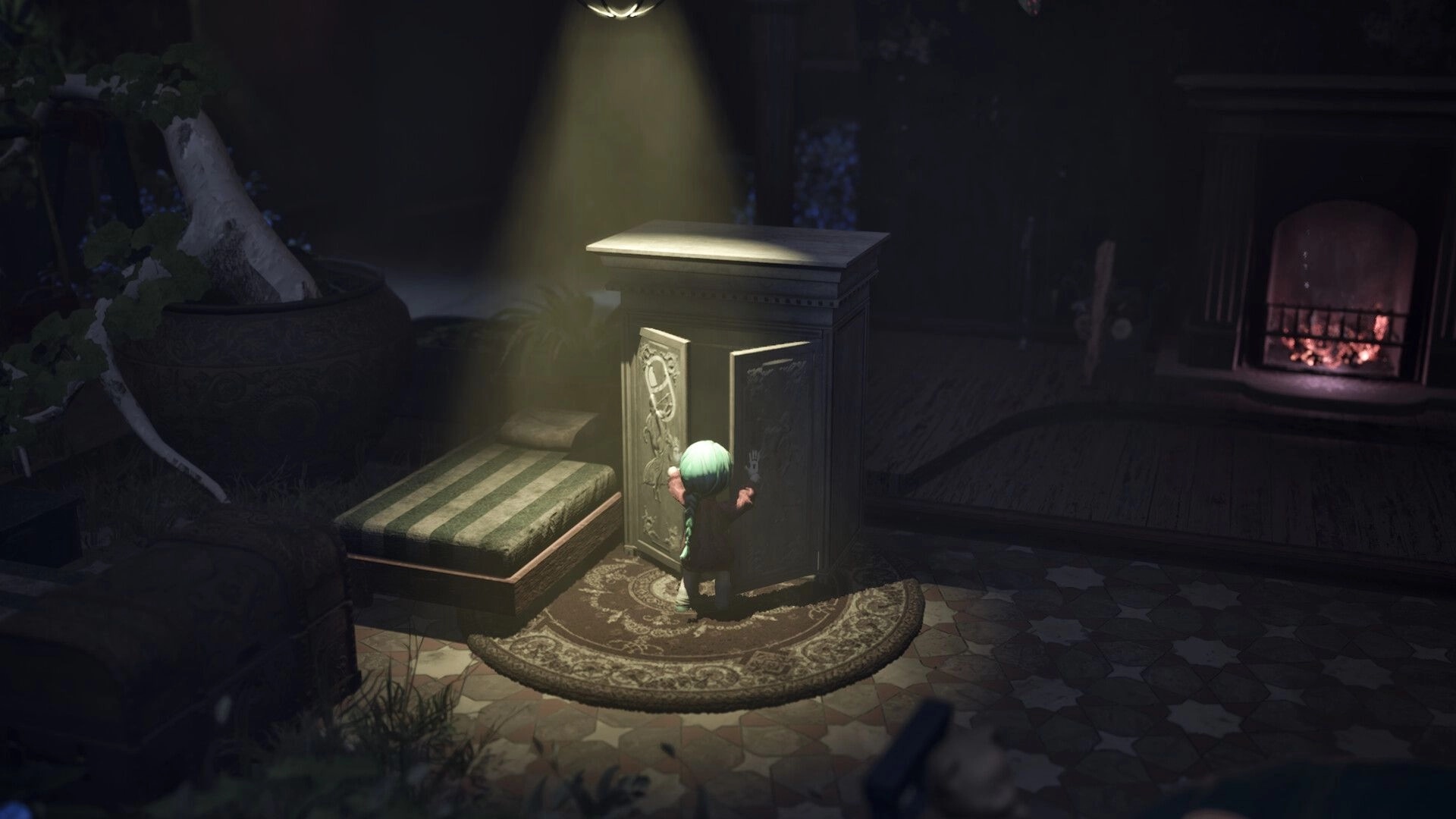Floralis: Character with green hair opens ornate cabinet under spotlight in dimly lit room with fireplace.