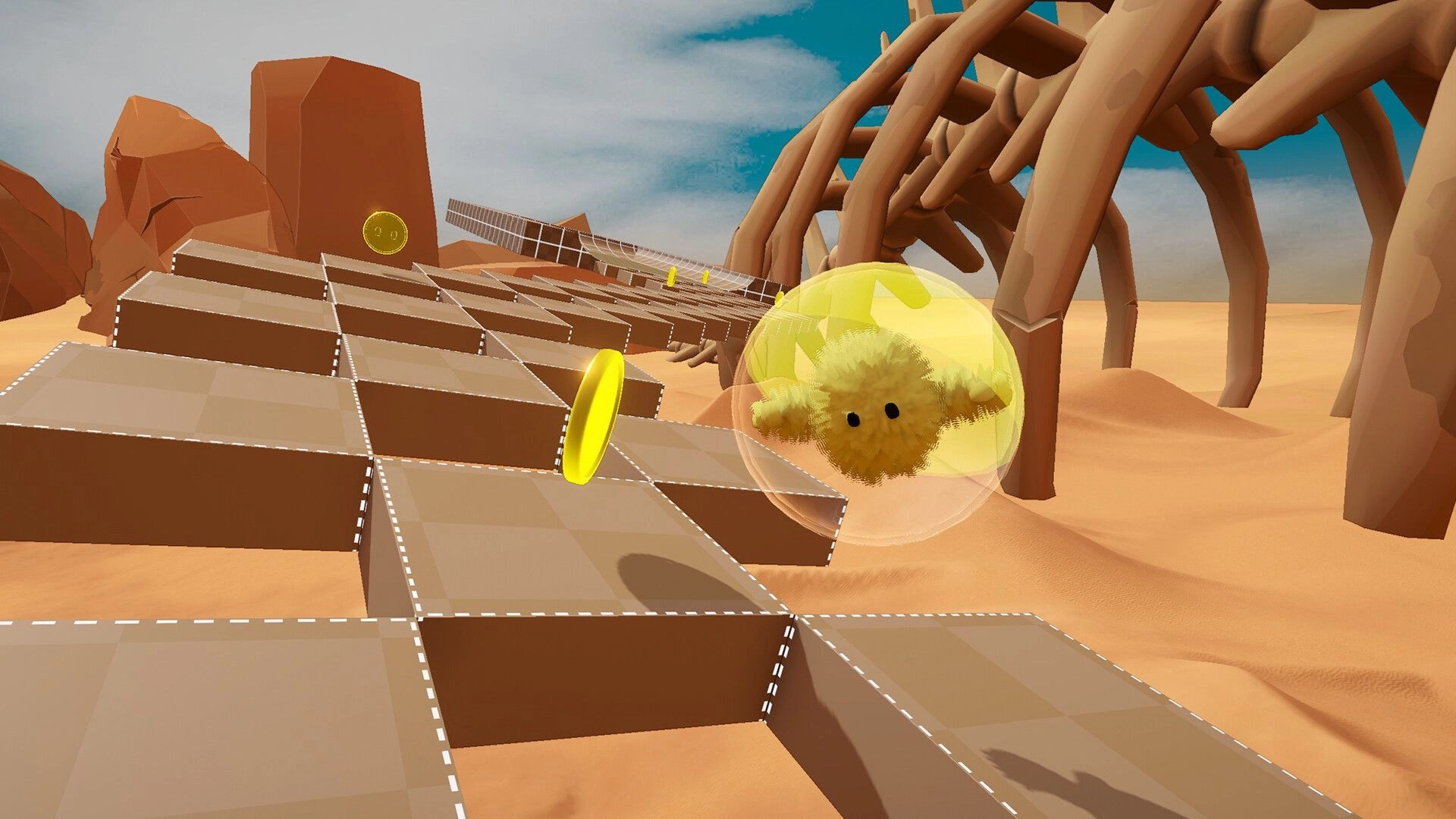Fluff'n'Roll: Fuzzy ball in bubble rolls toward gold rings on blocky desert ramps by giant ribs.
