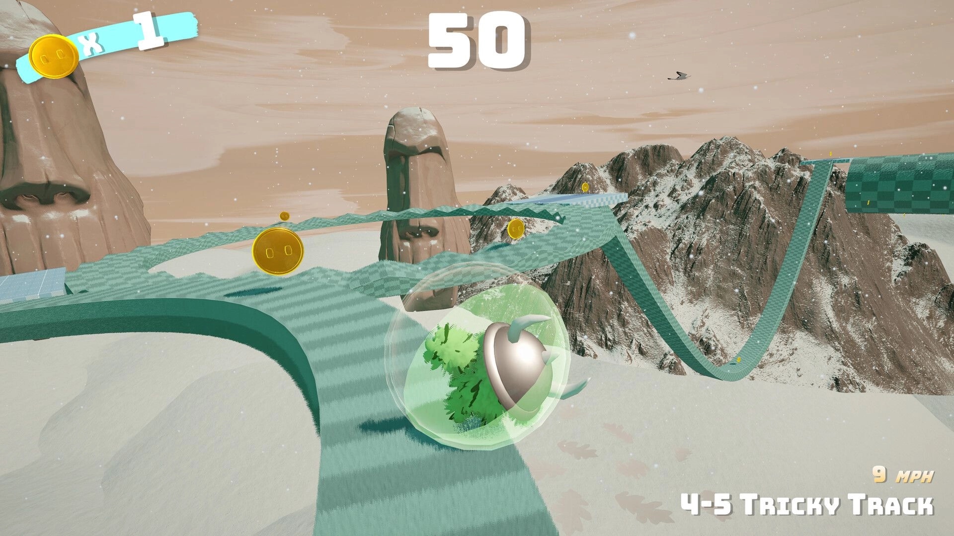 Fluff'n'Roll: Green ball rolls on icy winding track with coins, timer 50, 9 MPH, snowy peaks backdrop.