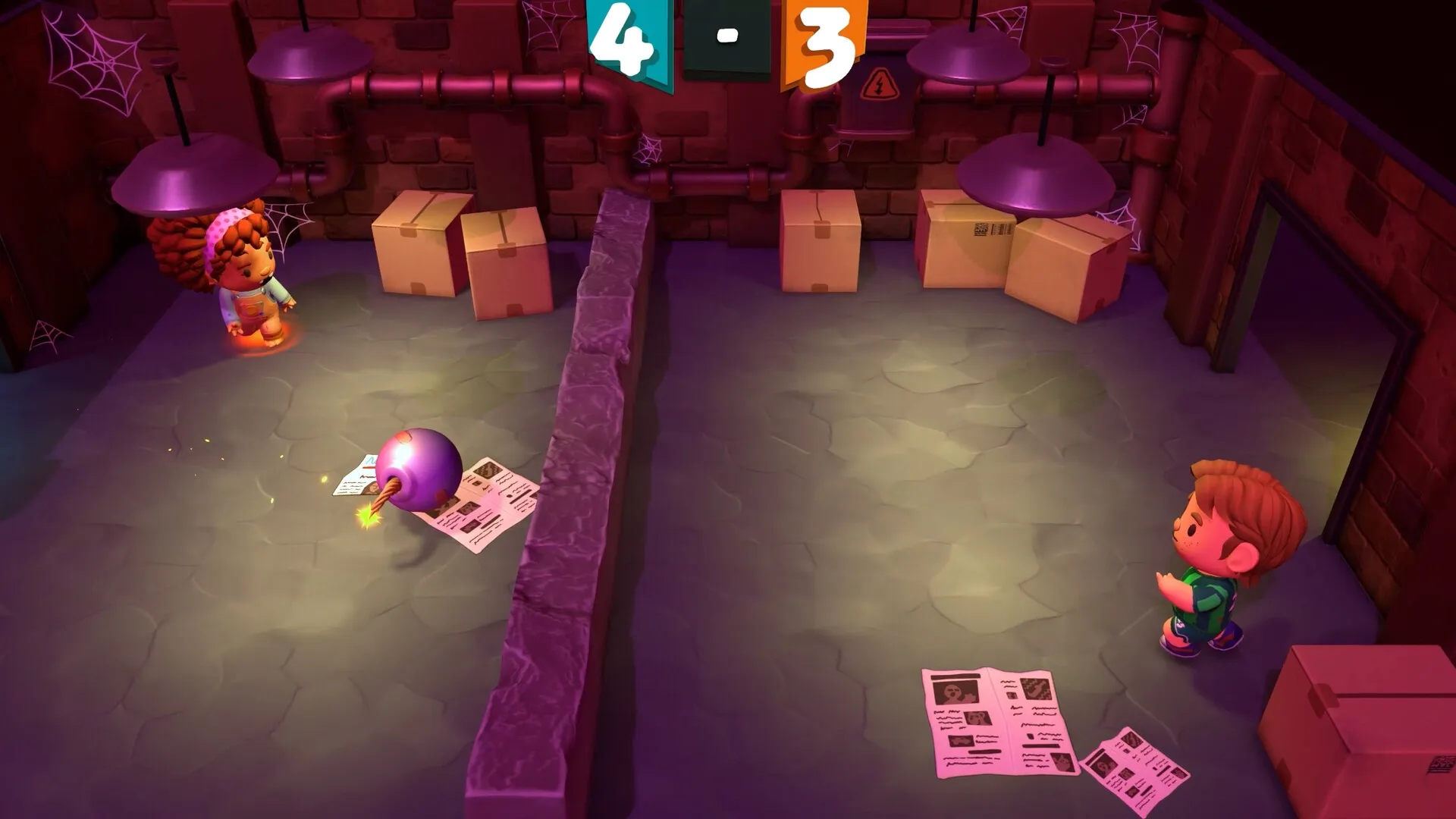 Footsy: Two players face off with a lit bomb on the floor in a basement with boxes and cobwebs.