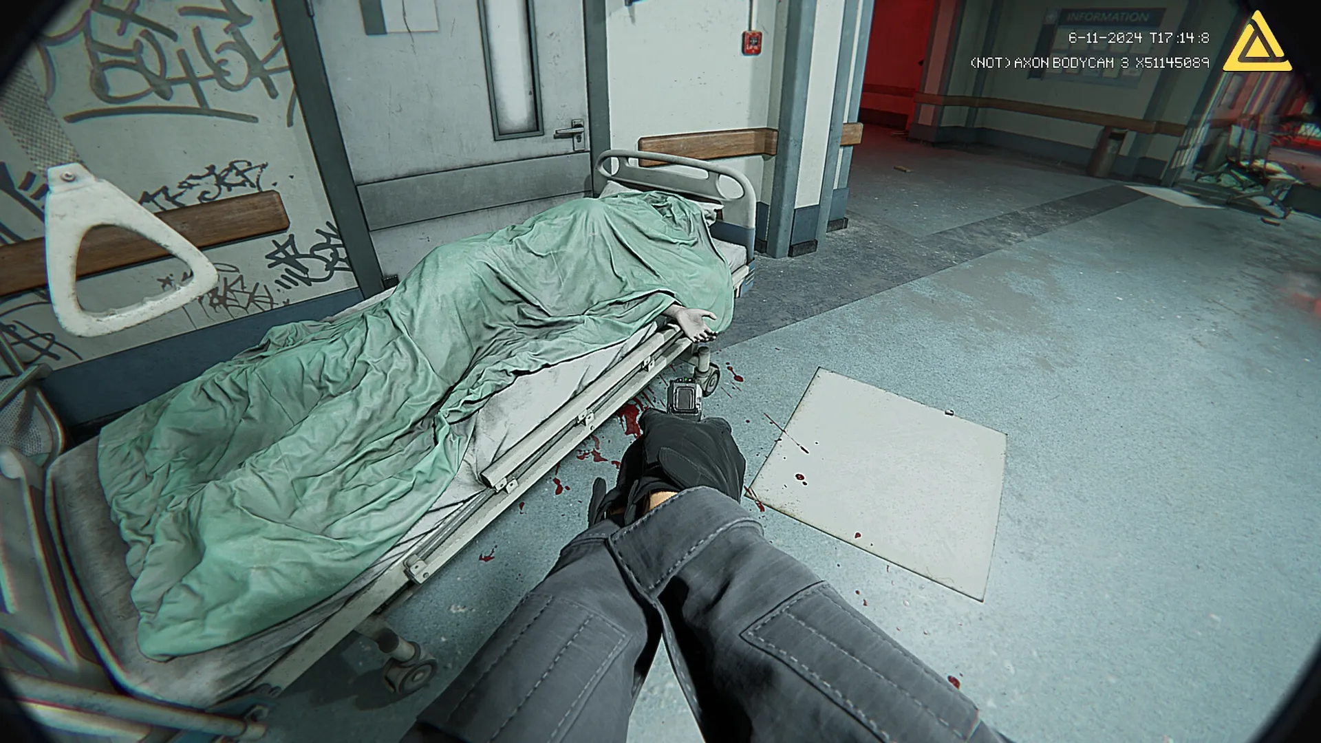 Fractured Mind: Player aims gun at covered body on stretcher in graffiti-filled hospital corridor