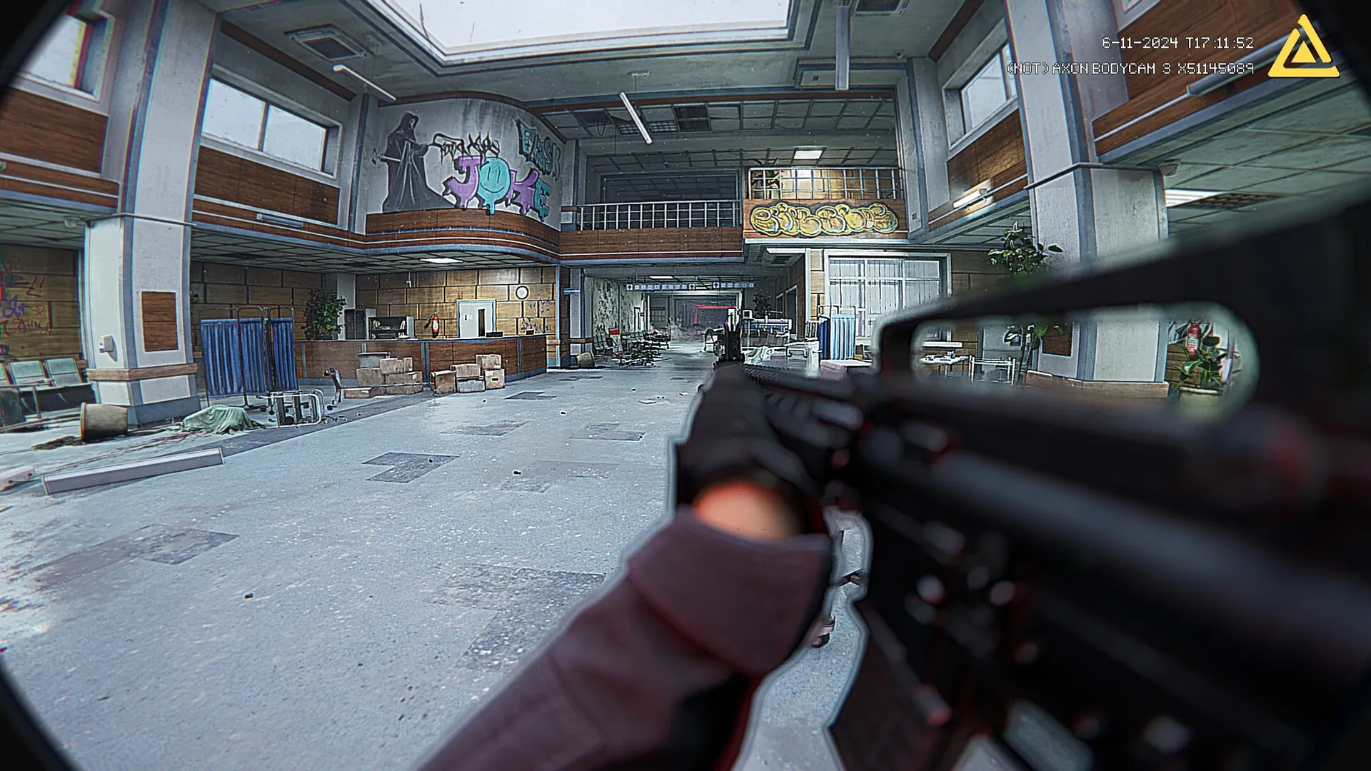 Fractured Mind: Player aims rifle in abandoned hospital lobby with graffiti and scattered debris