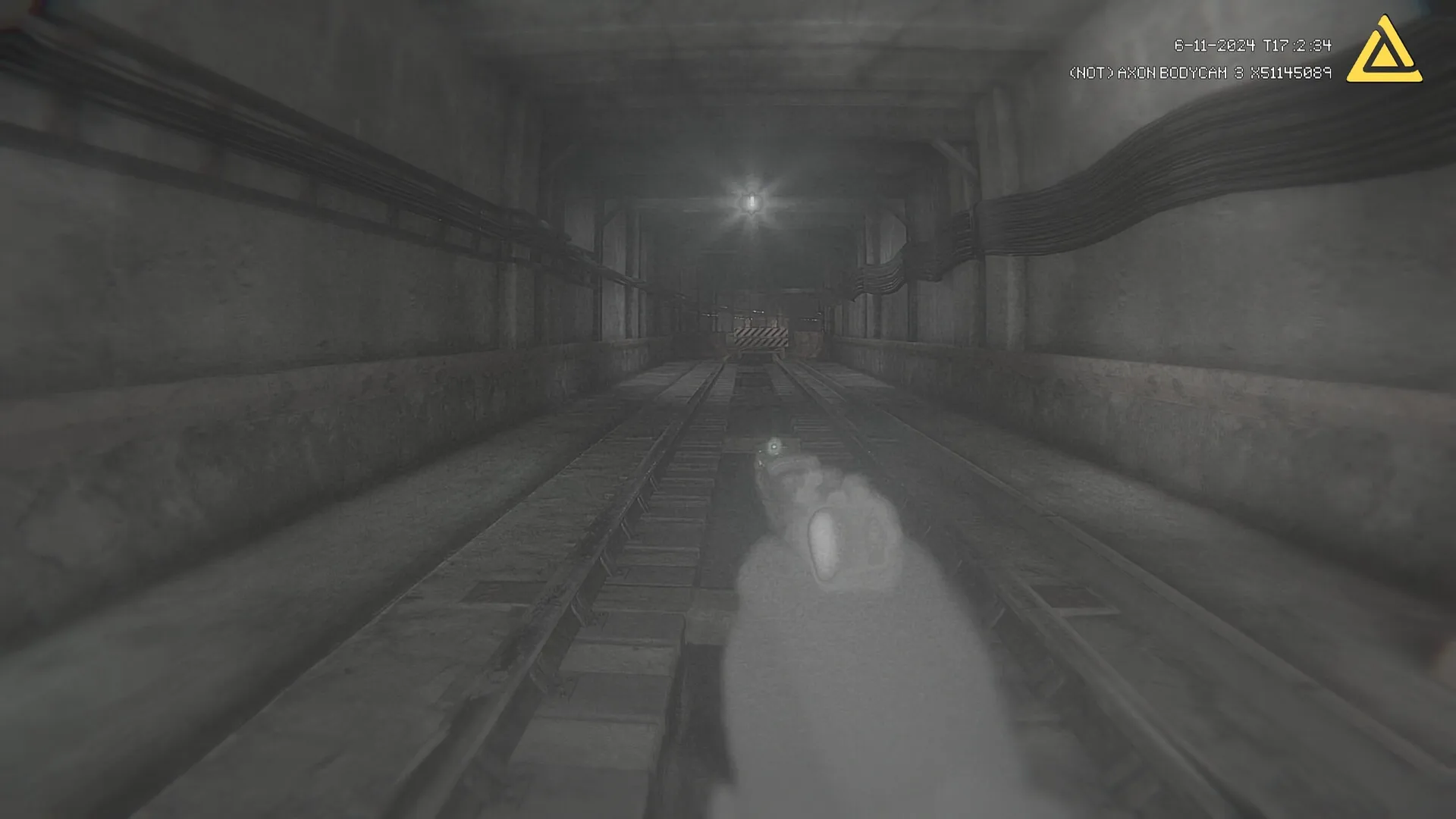 Fractured Mind: First-person view of dimly lit underground tunnel with bodycam UI elements visible