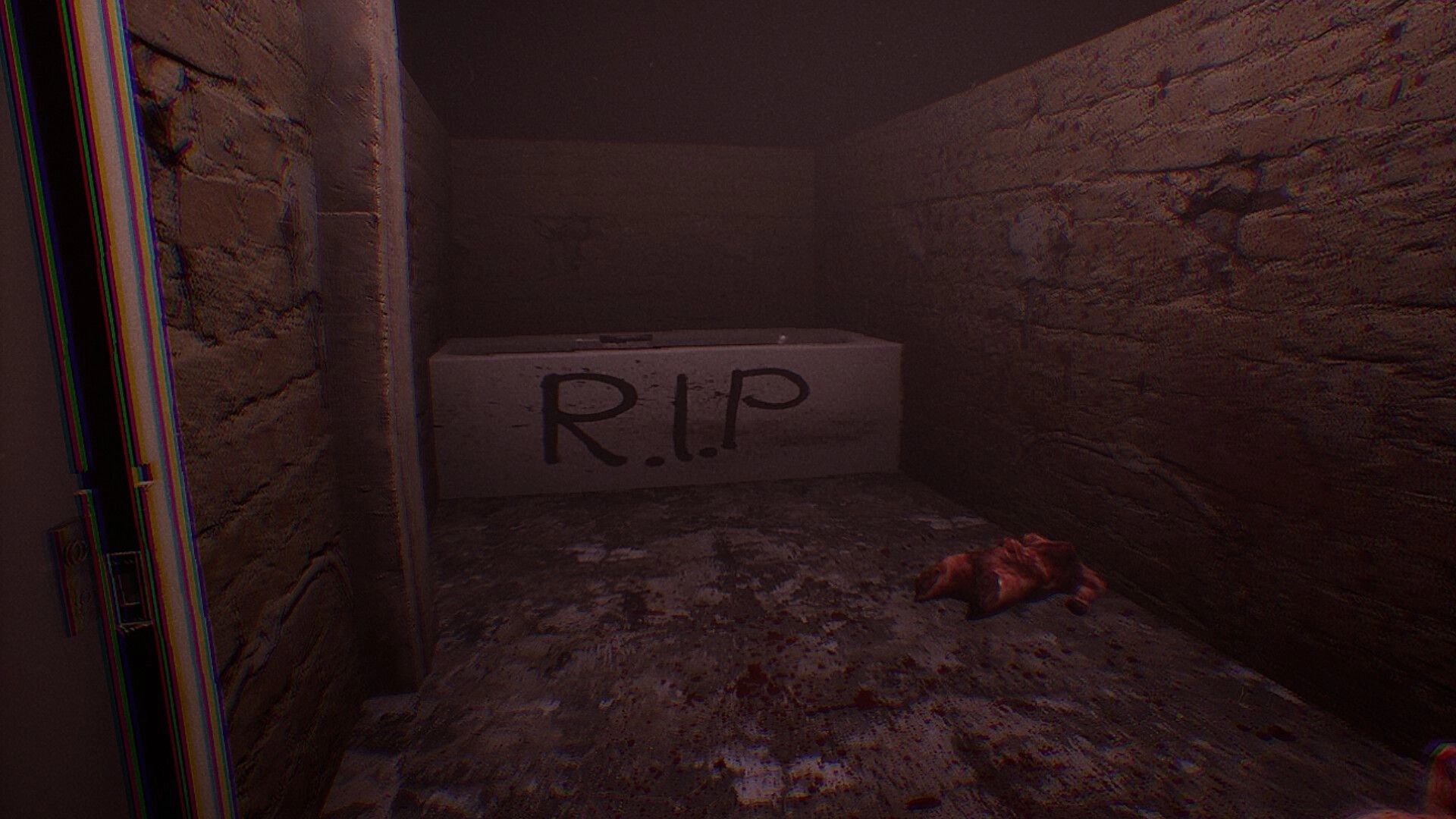 From Devil's Womb: Dark corridor with blood-stained floor and "R.I.P" marked stone slab.