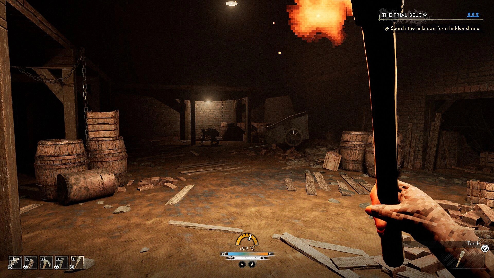 Frostrail: Player holds a torch exploring a dim barn with barrels, cart, and quest UI visible.