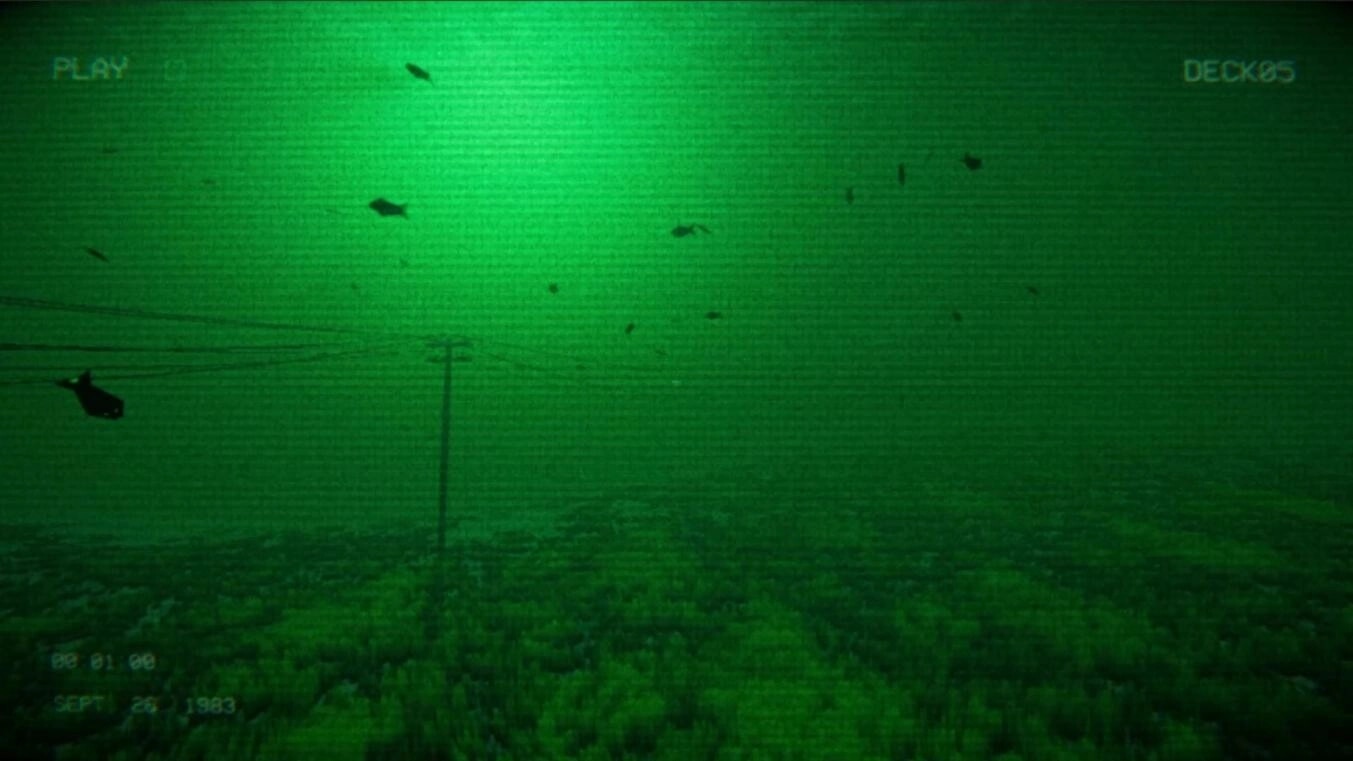 Full Fathom: Night-vision camera view of seabed with drifting debris and deck label UI overlay.