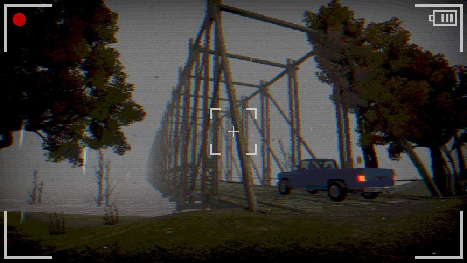 Geamana Village: Old truck crossing a rickety wooden bridge in foggy, tree-lined landscape through camera view.