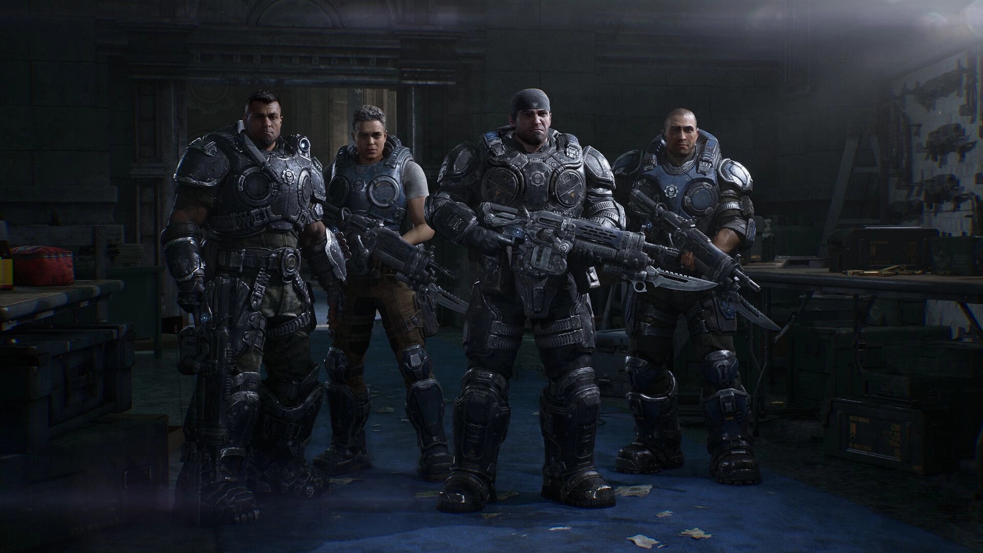 Gears of War: Four armored COG soldiers pose with rifles in a dim military workshop with crates.