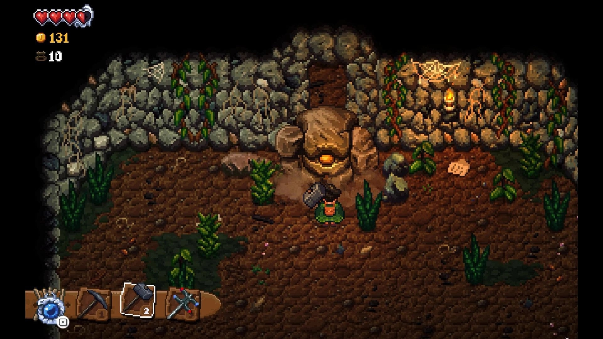 Glintseeker Island: Player faces a stone furnace in a viney cave with hearts, coins, tool bar UI.