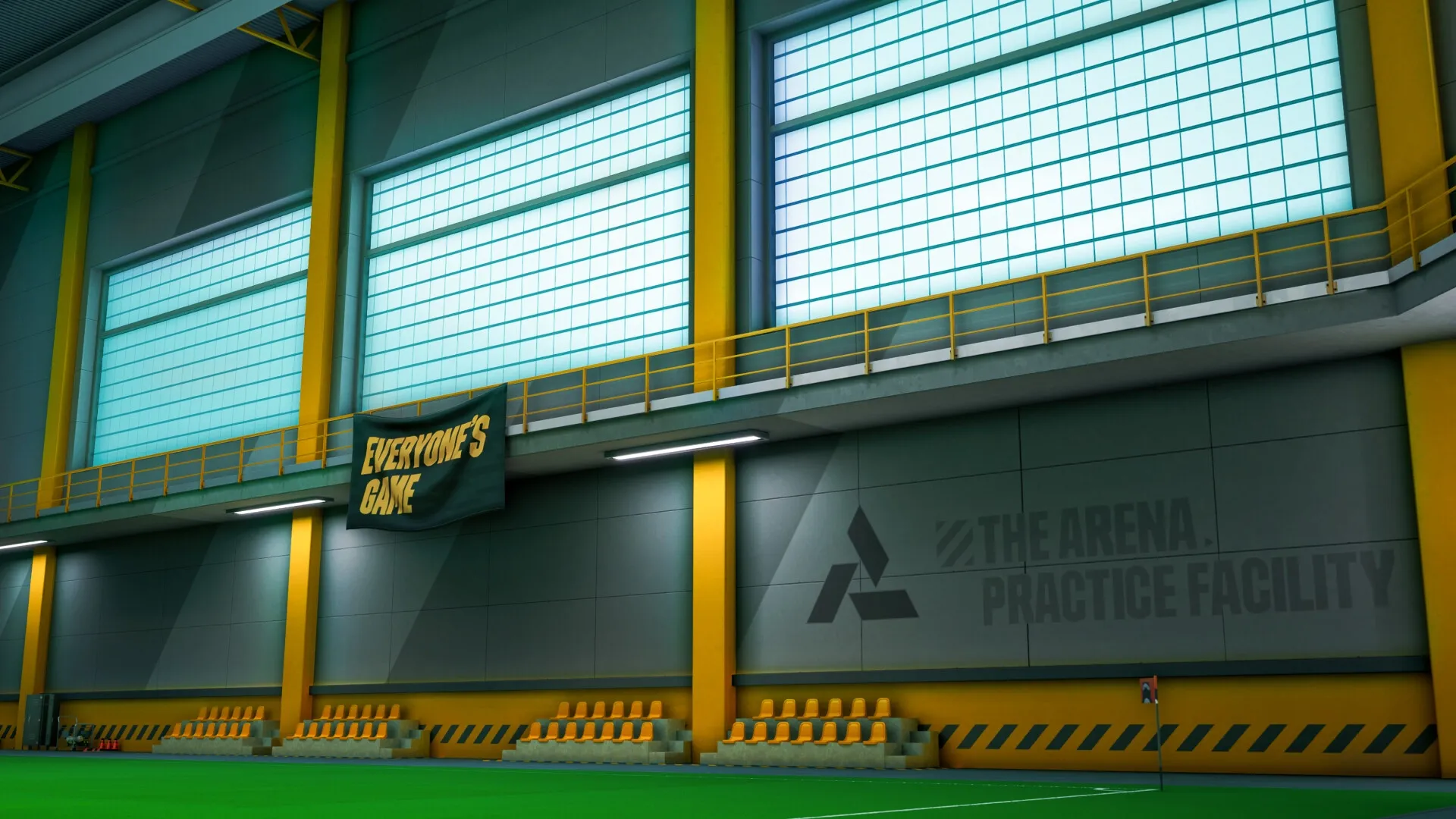 GOALS: Interior view of practice facility with seating, banner, and large windows