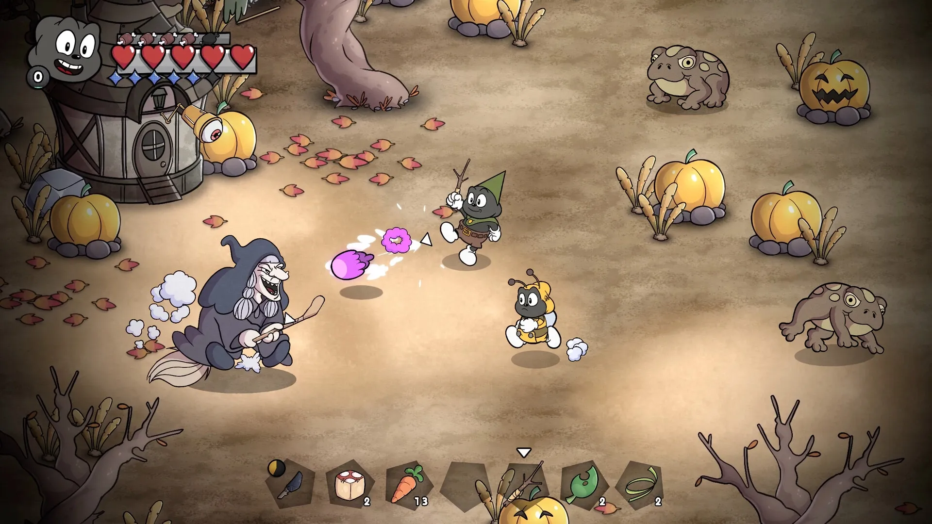 Gombo: Witch battle in pumpkin patch with health bar and inventory icons visible