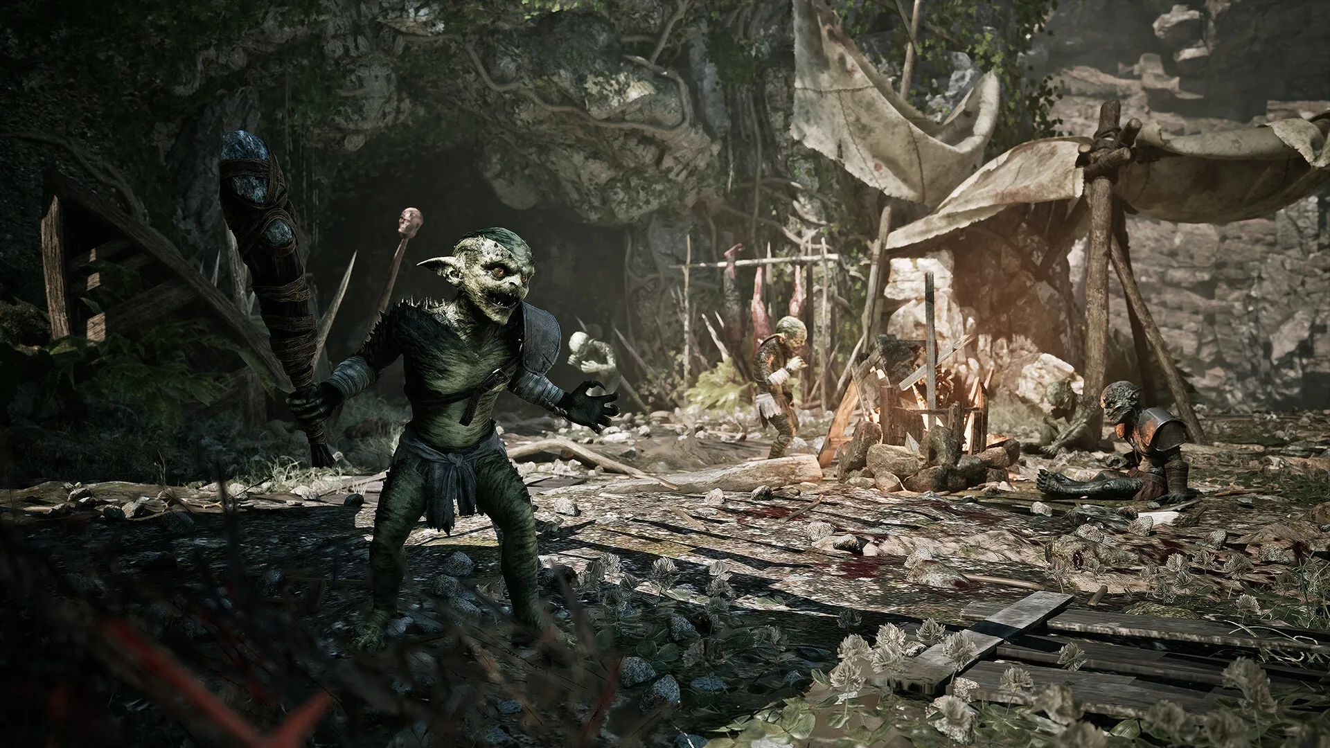 Gothic 1 Remake: Goblins gather around a campfire in a forest clearing with tents and wooden structures.