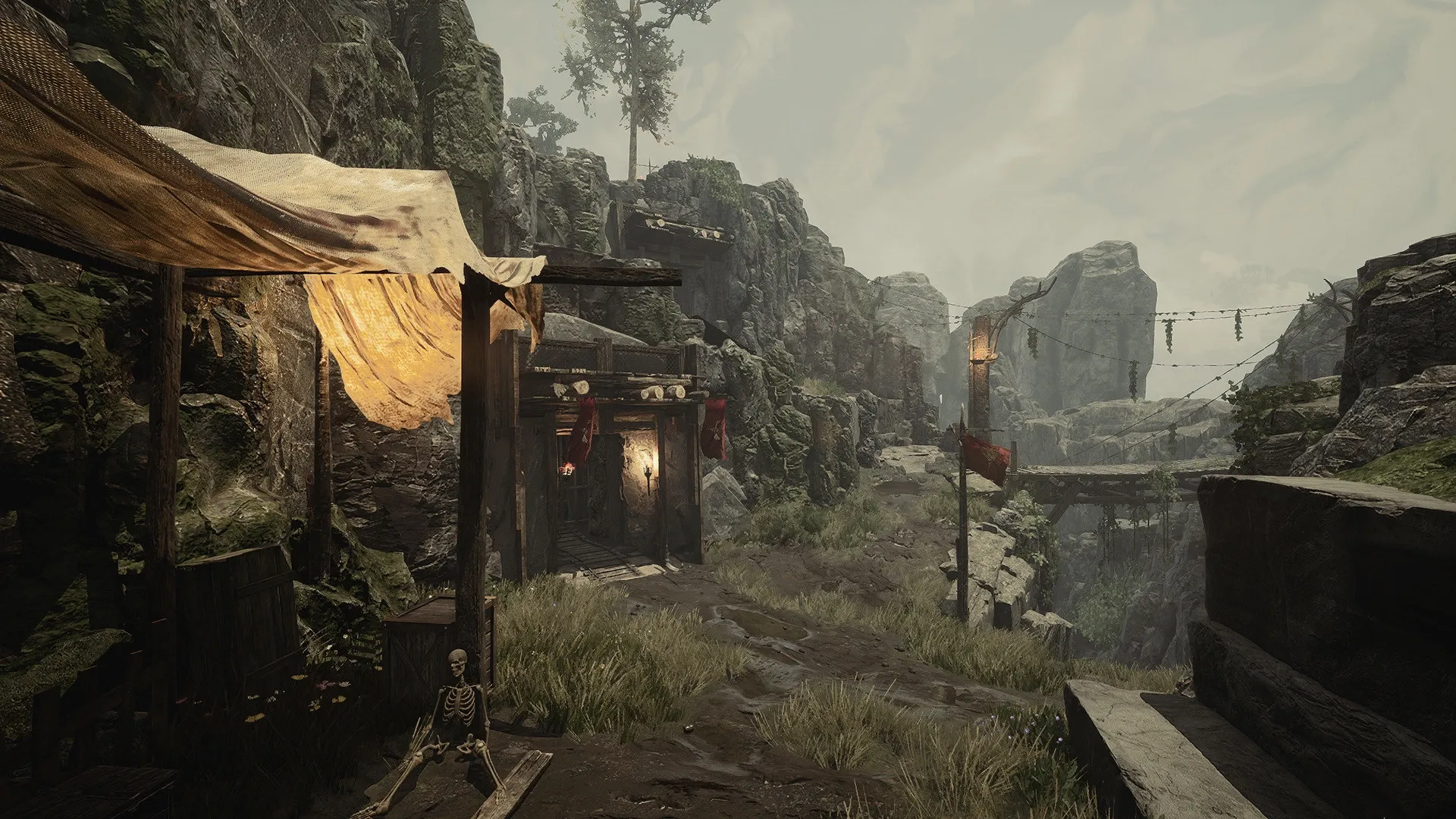 Gothic 1 Remake: Skeleton near an abandoned mine entrance in a rugged, mountainous landscape