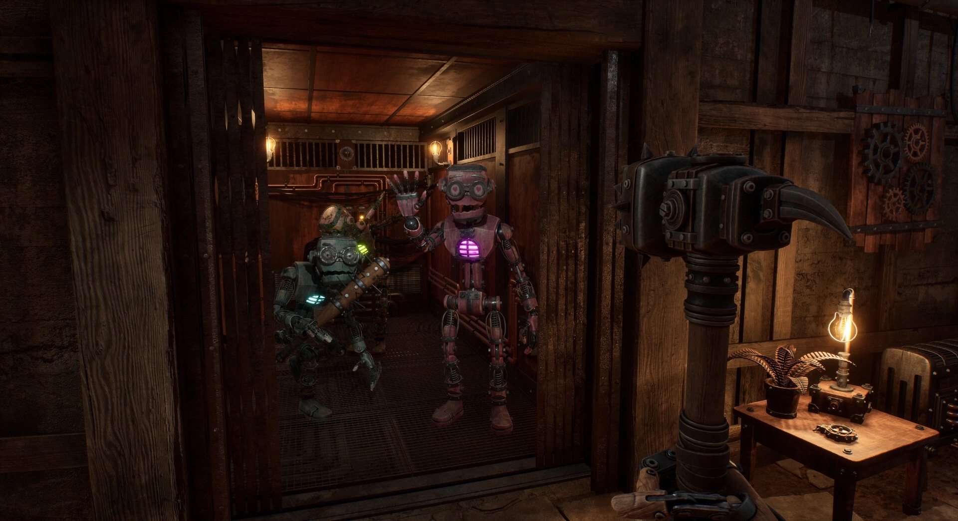 GRAIN ROT: Two robots pose in a wooden elevator bay beside a claw hammer and lamp-lit worktable.
