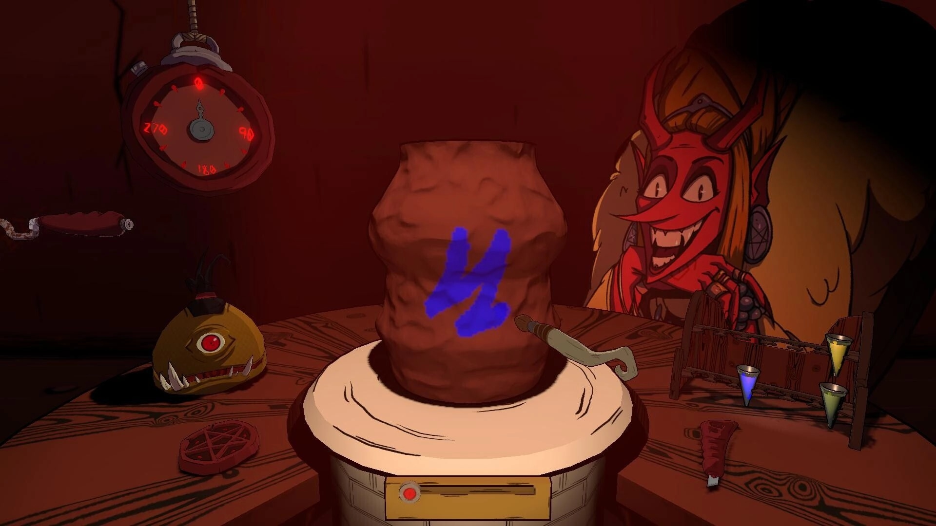 Greda Inferno: Shaping a clay vase on a pottery wheel with tools and a grinning demon in workshop.