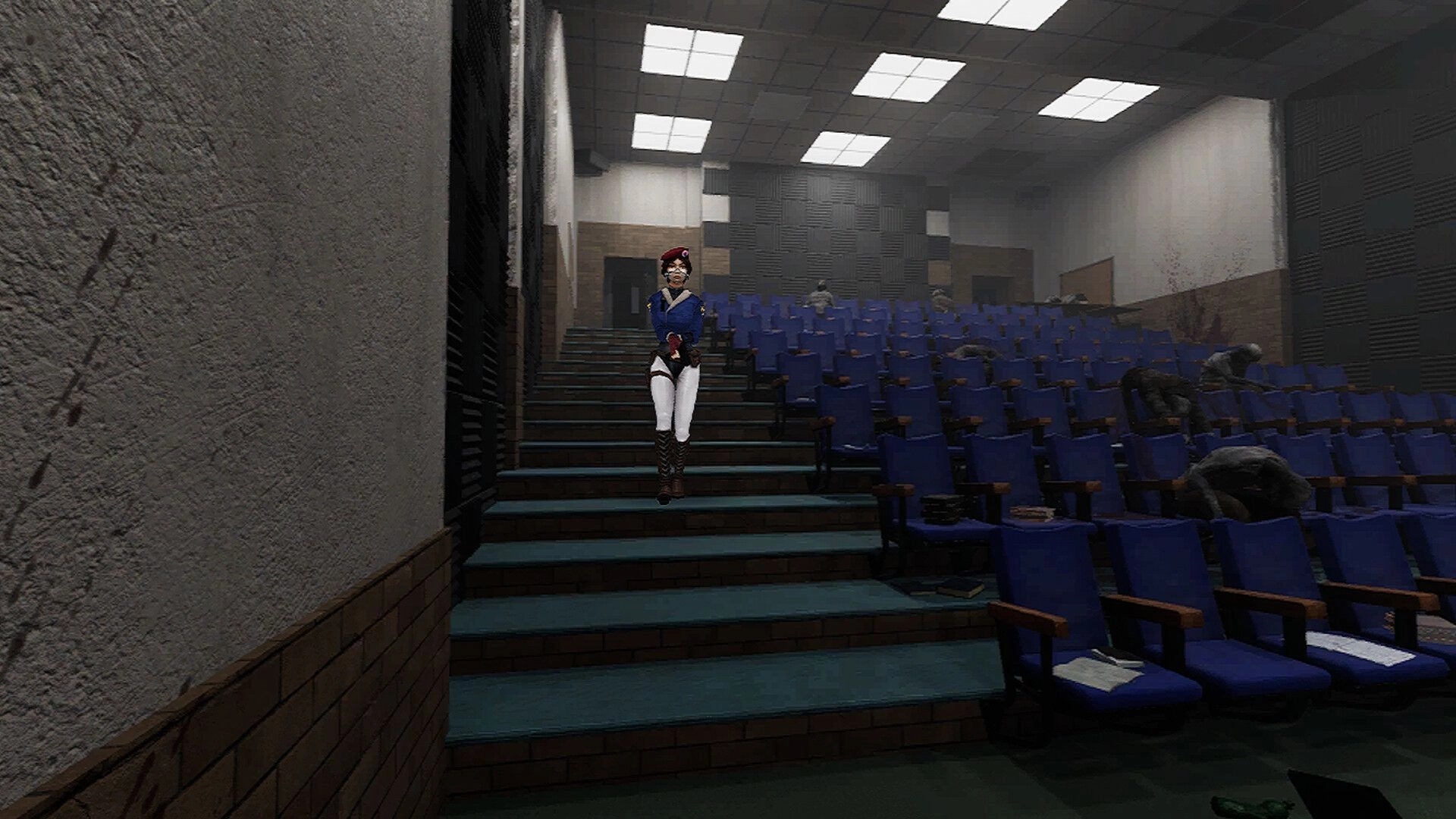 Ground Zero: Character descends theater stairs surrounded by empty blue seats and lurking creatures