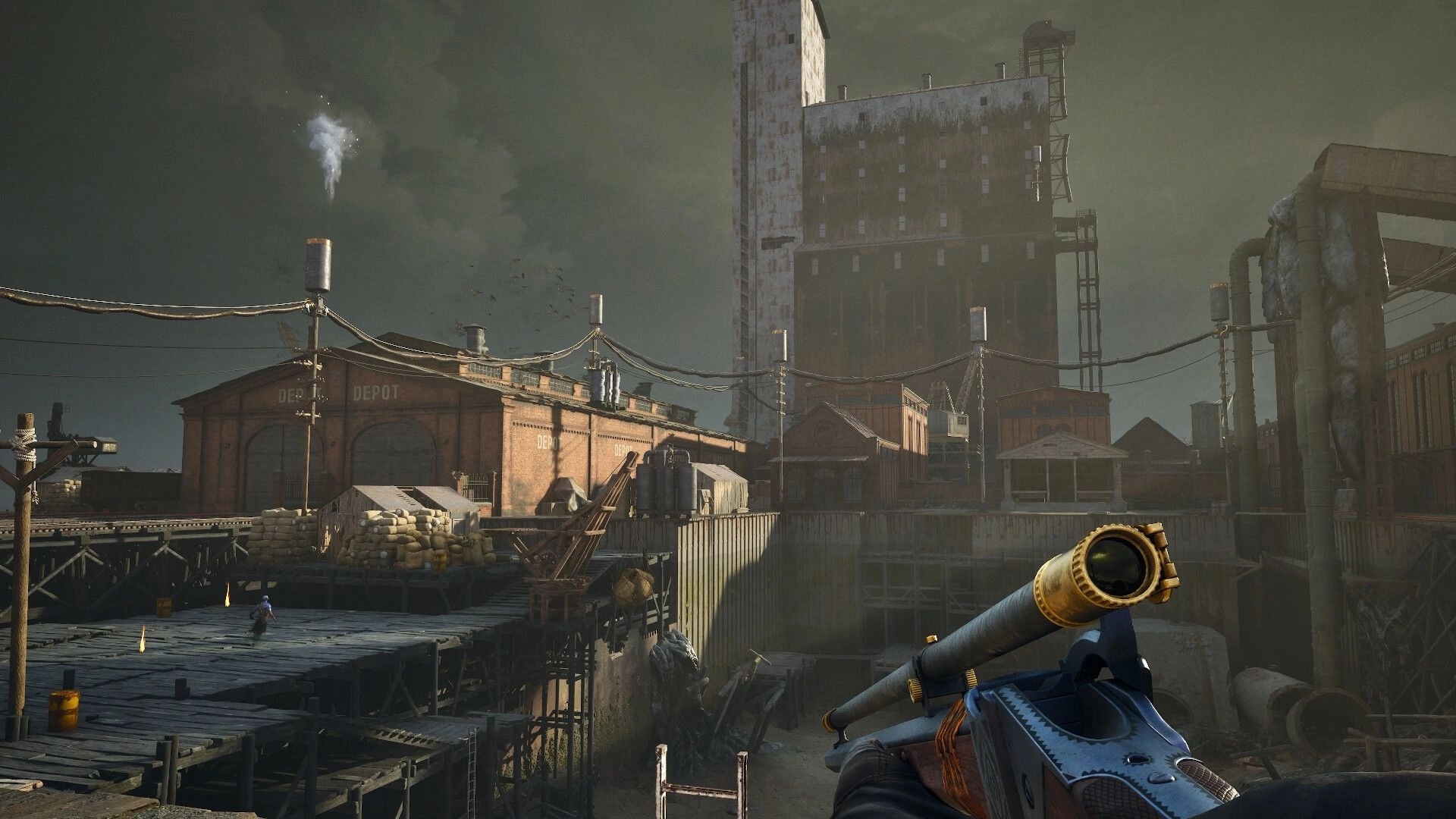 Guns of Eschaton: First-person view aiming a rifle over a grim industrial depot and docks at dusk.