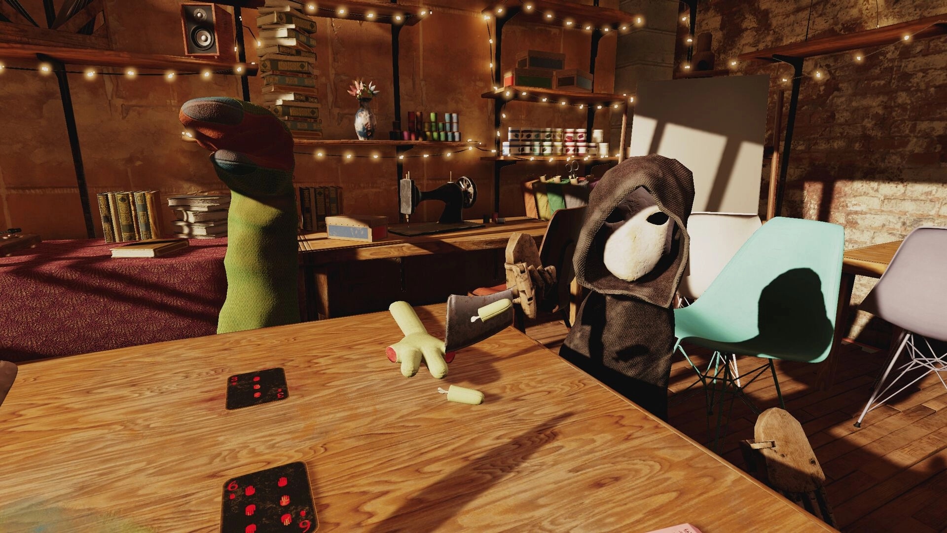 Handsum: Sock puppet characters playing cards in a cozy room with books, lights, and a severed plush hand.