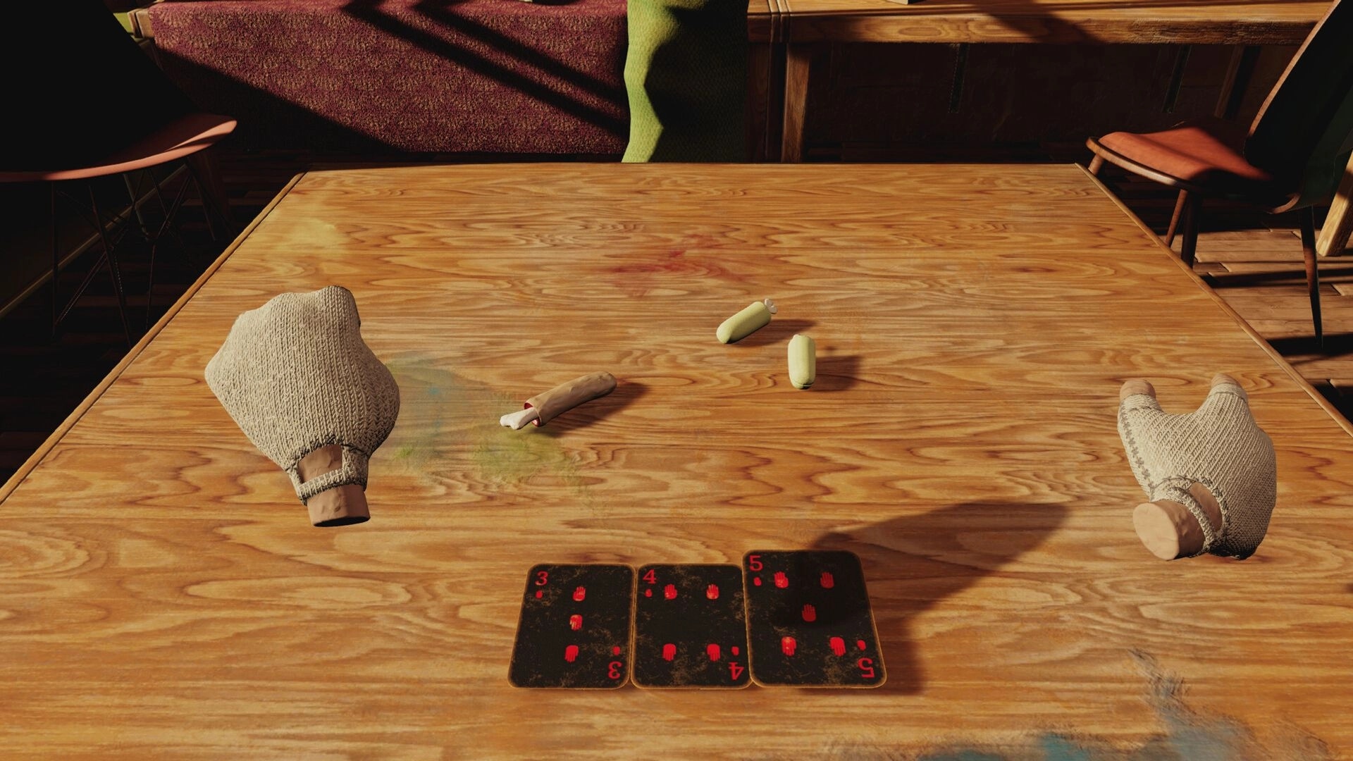 Handsum: Three cards with red hand symbols on table, two gloved hands, and fingers as game tokens