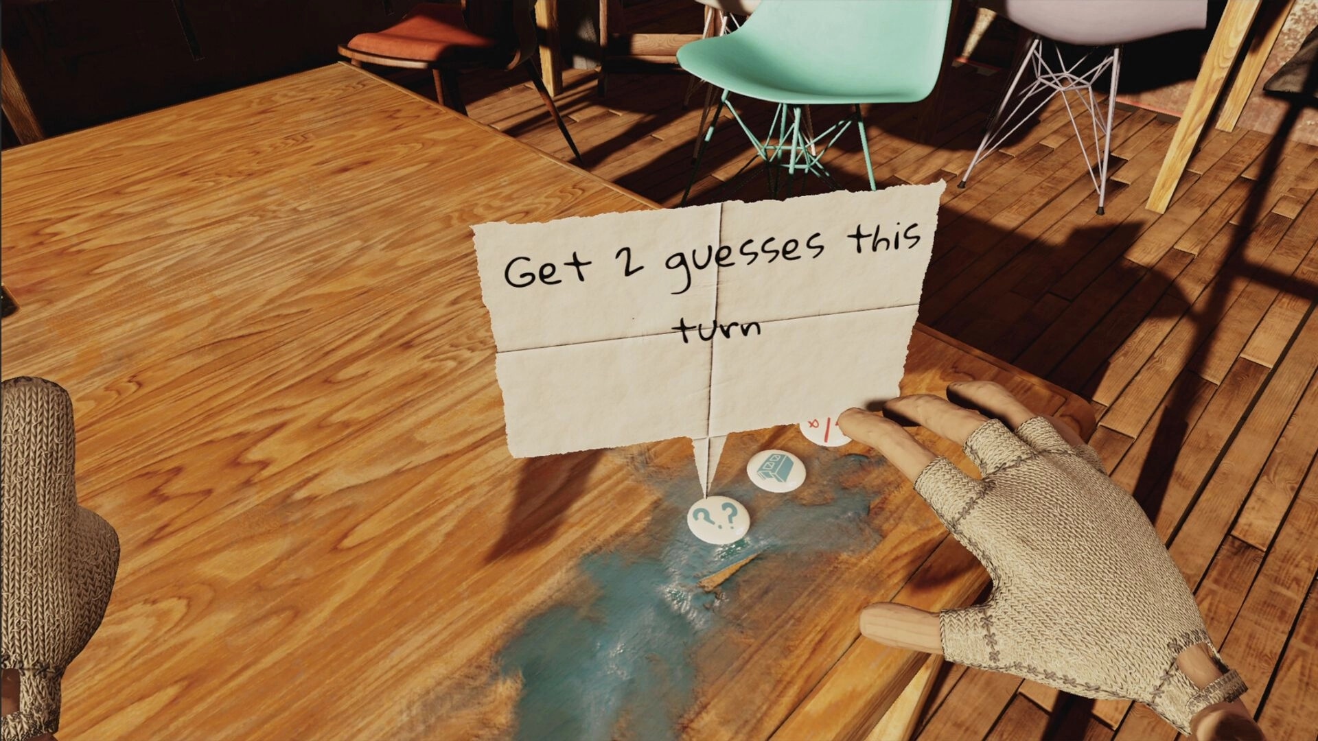 Handsum: Gloved hand selecting powerup cards on wooden table with note saying "Get 2 guesses this turn"