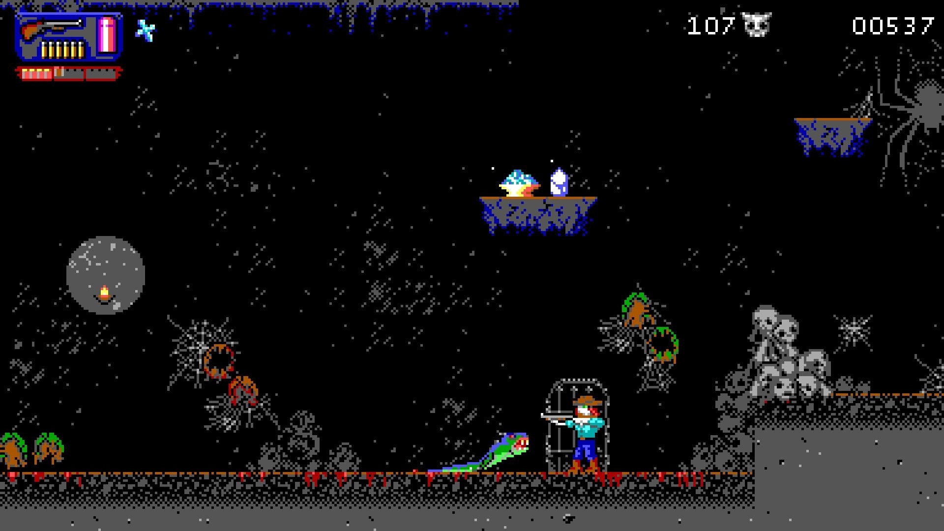 Haunted Lands: Player aims weapon at serpent creature in dark cavern with webs and skull piles nearby