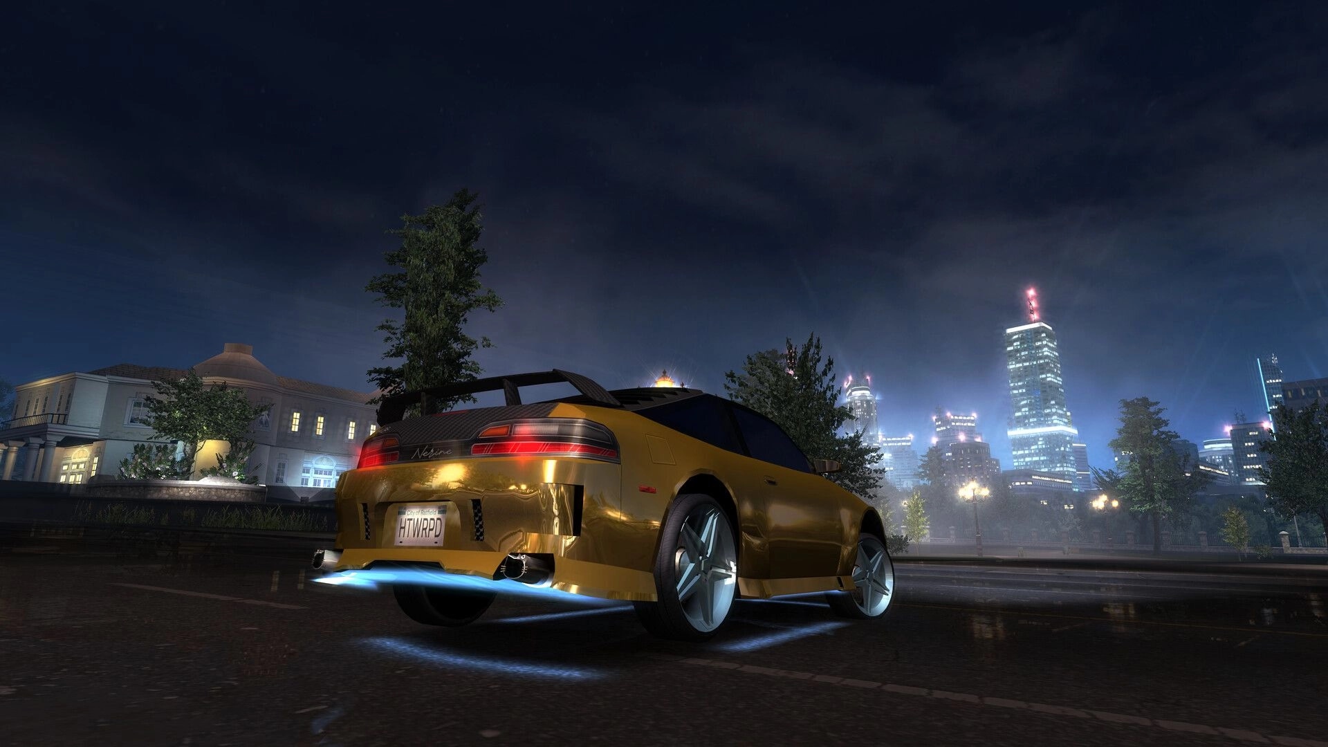 Heatwarped: Gold tuner car with neon underglow parked on wet street with city skyline at night.